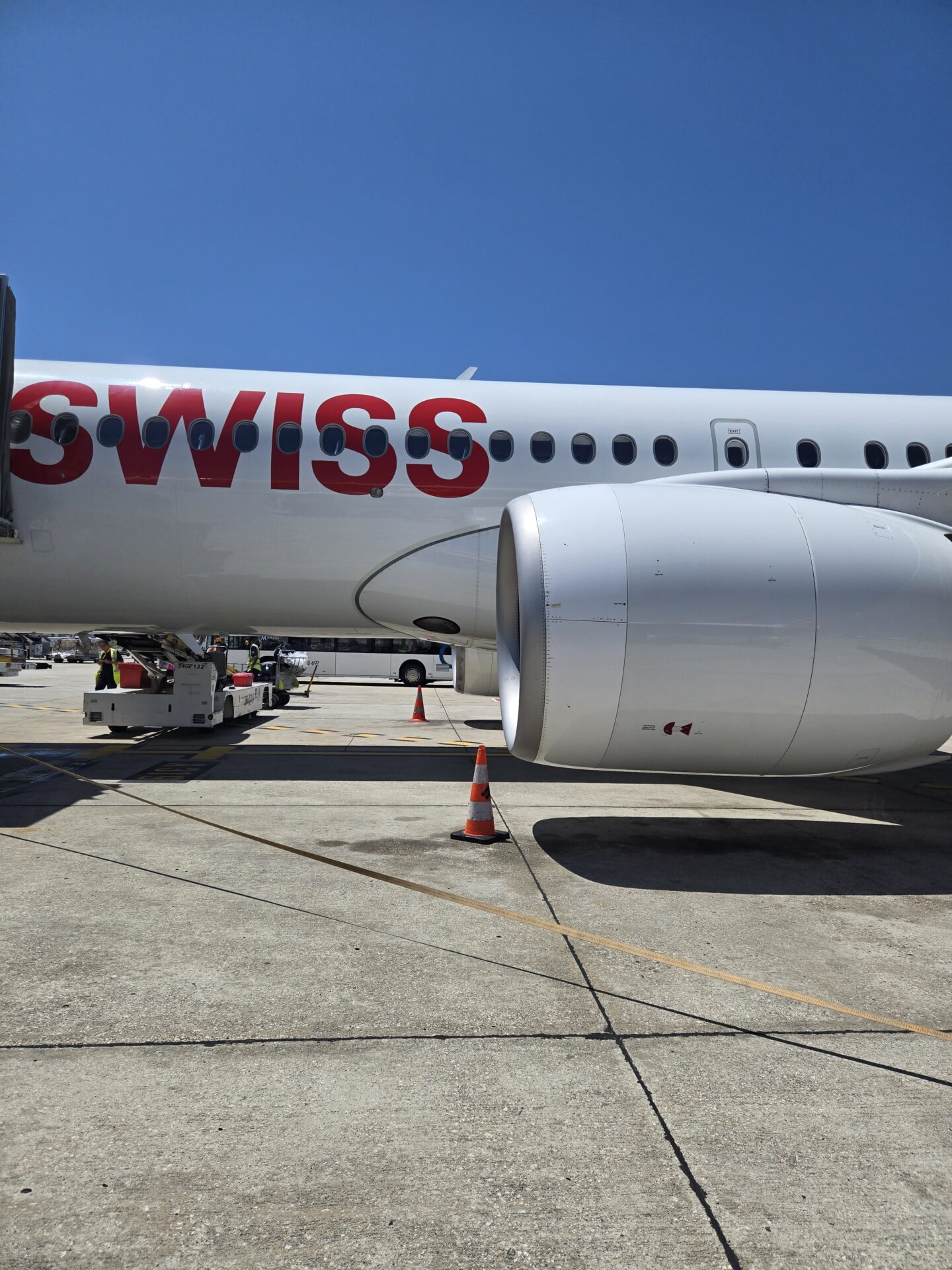 a large white airplane with red writing on it