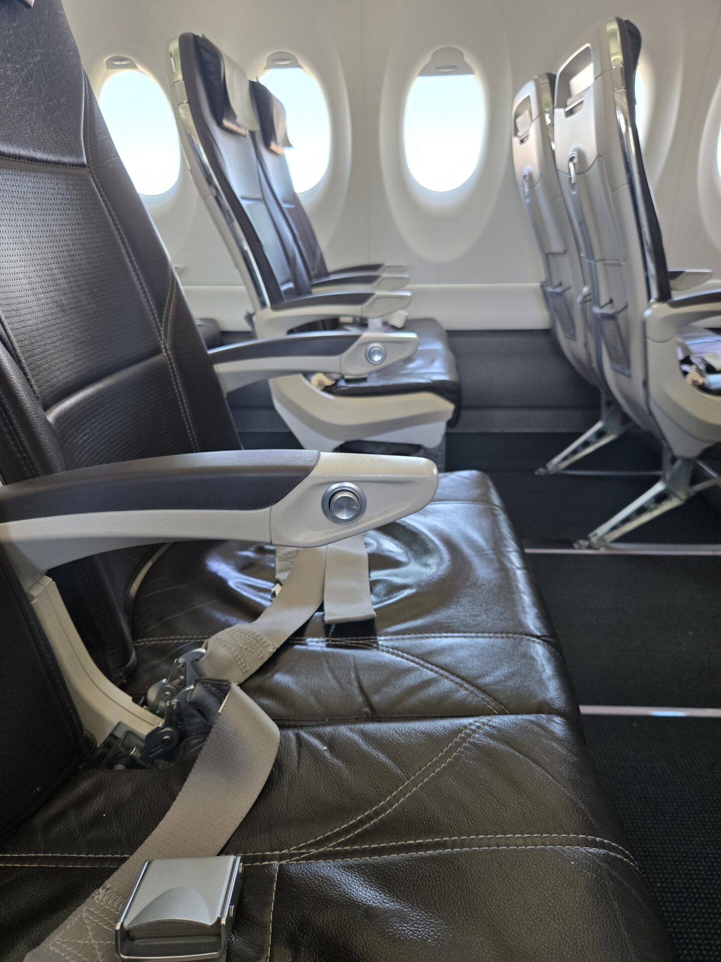 seats in an airplane with windows