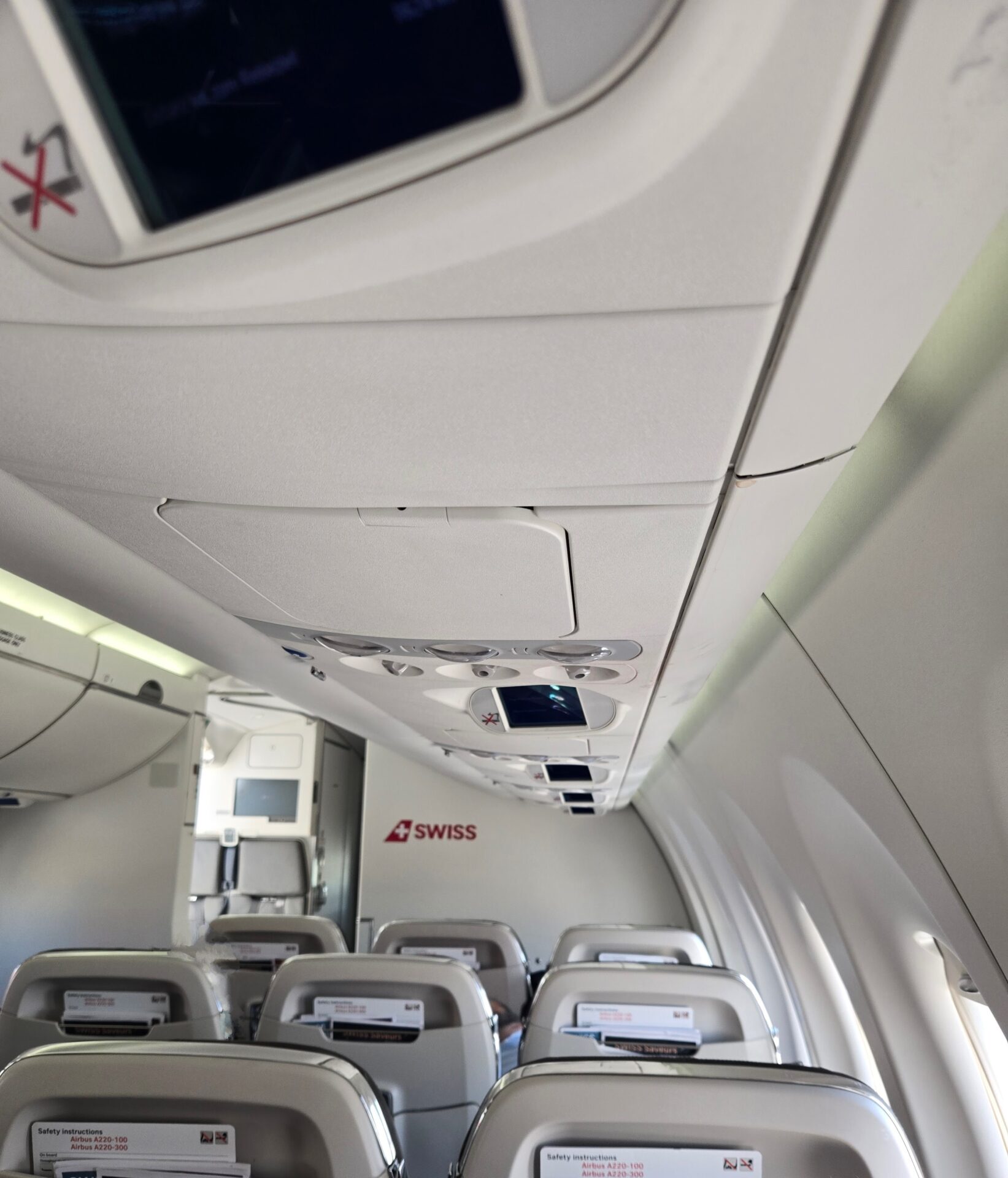 an airplane with seats and a screen