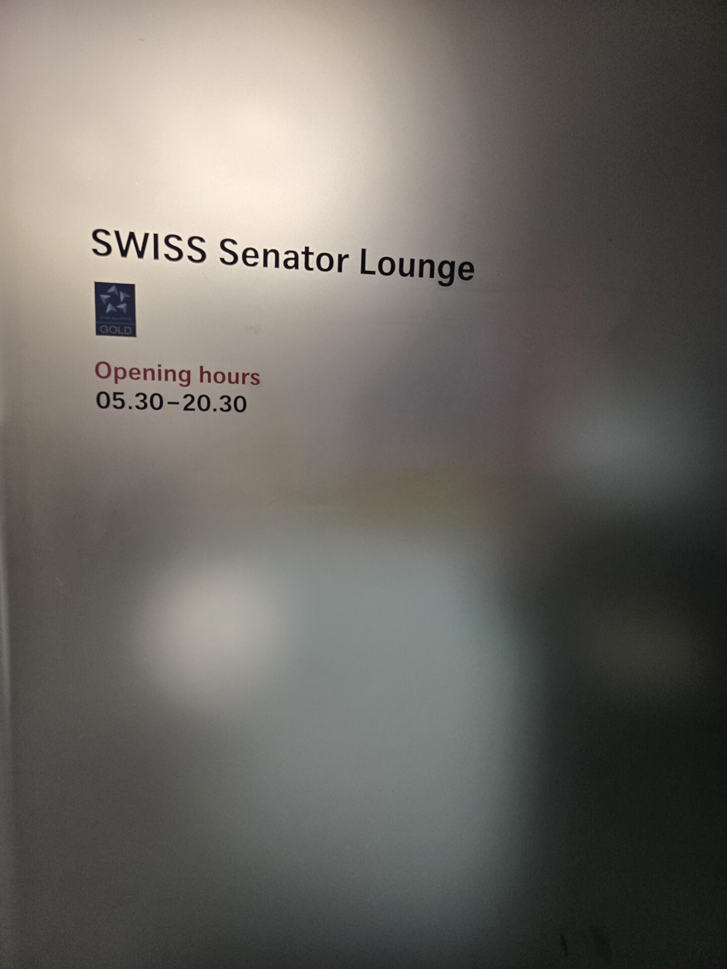 a sign on a glass door