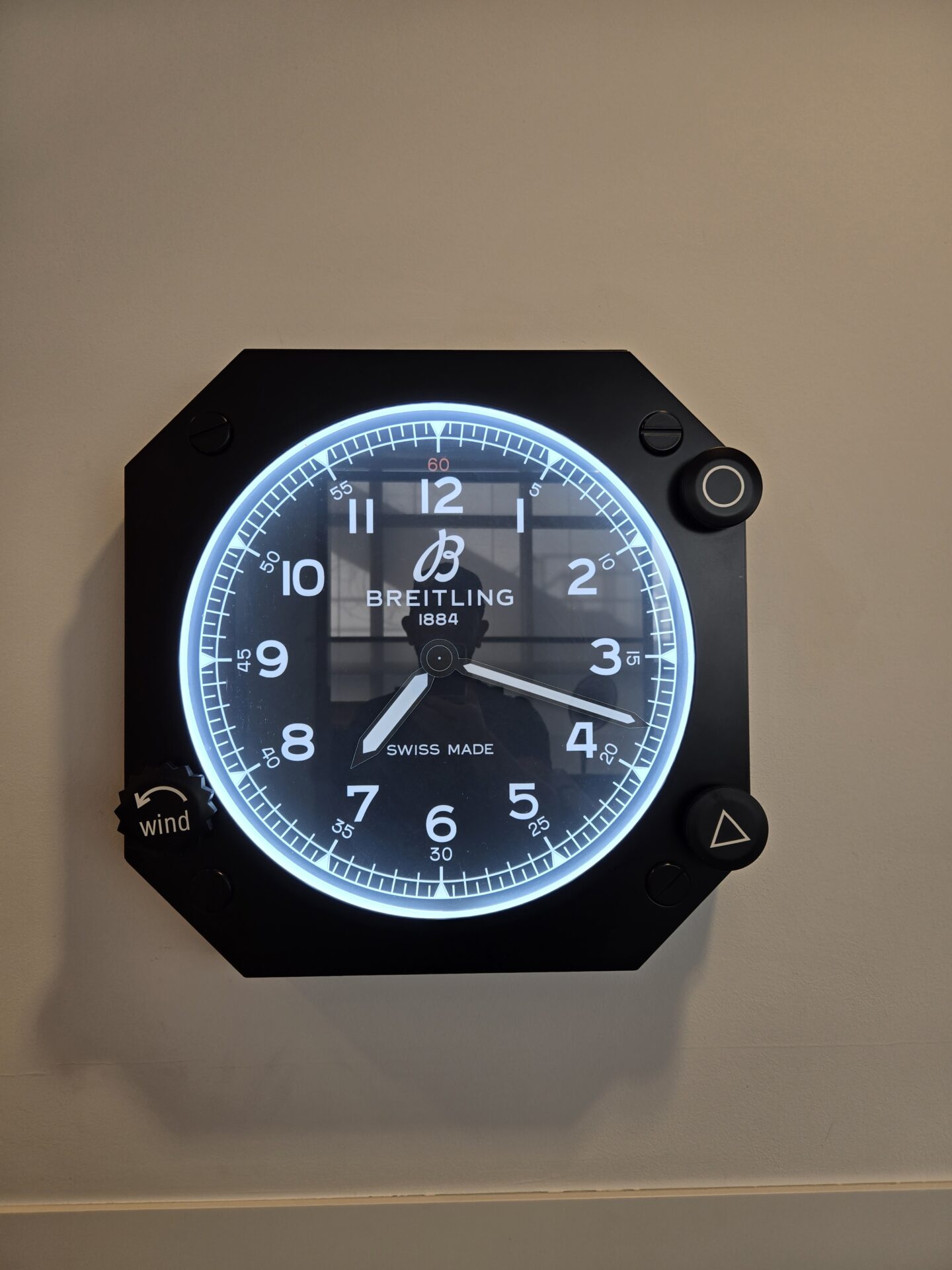 a black clock with white text