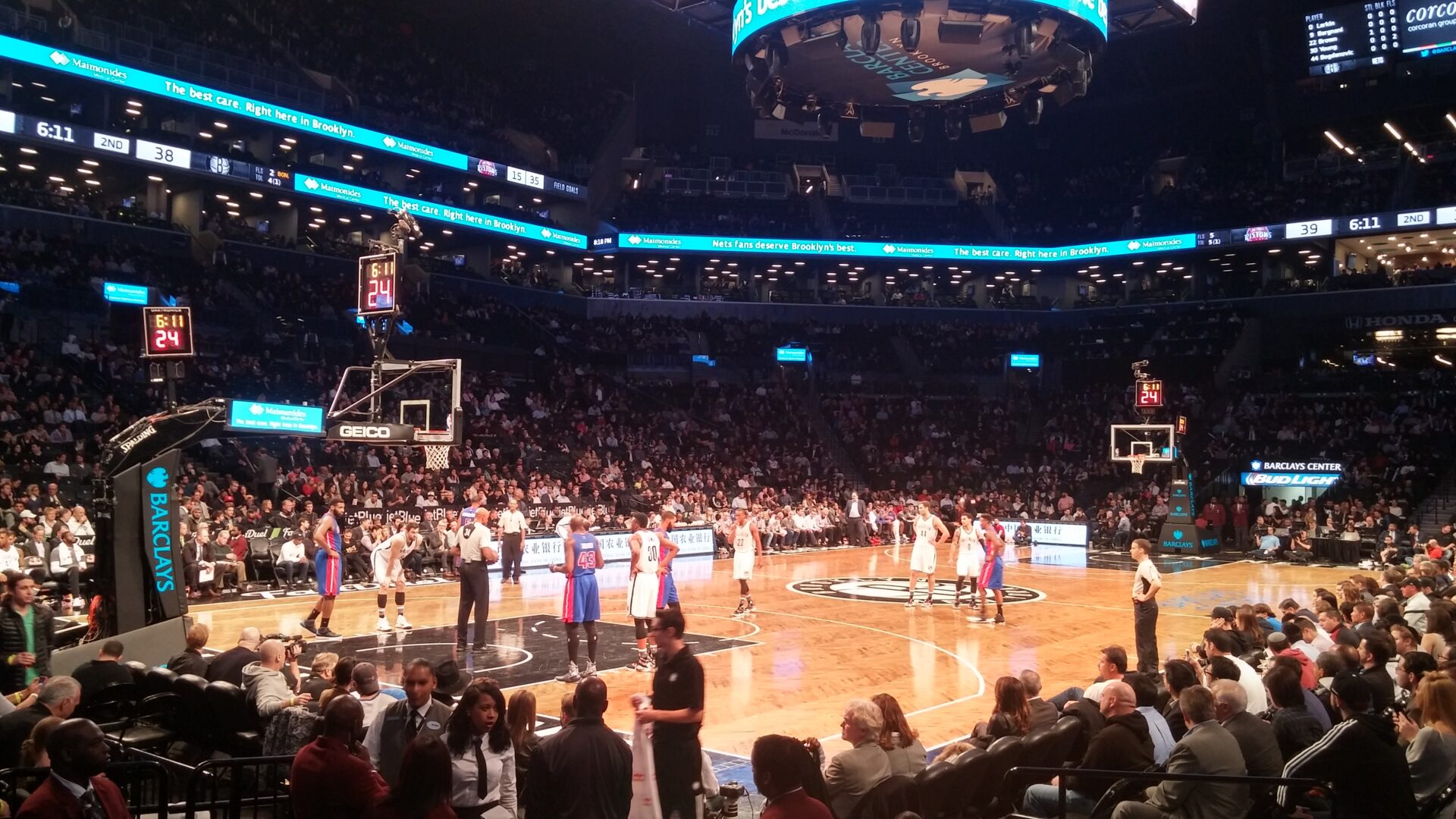a basketball game with people watching