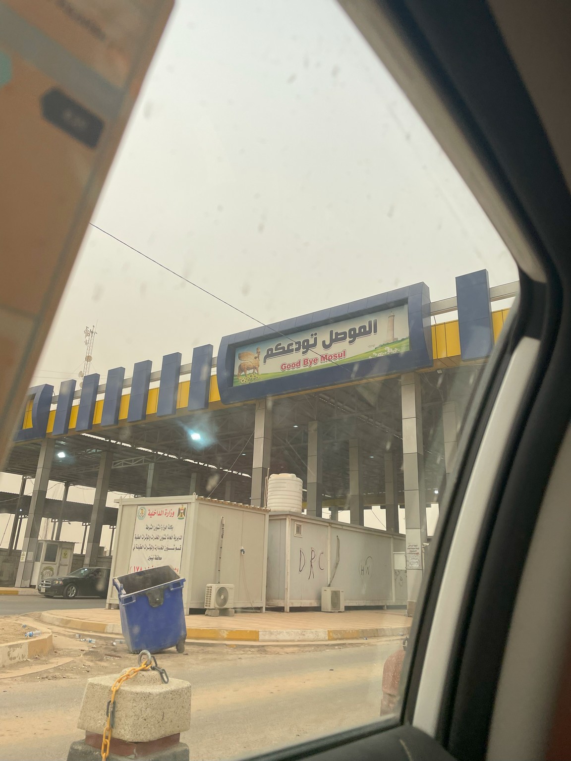 a view from a car window of a gas station