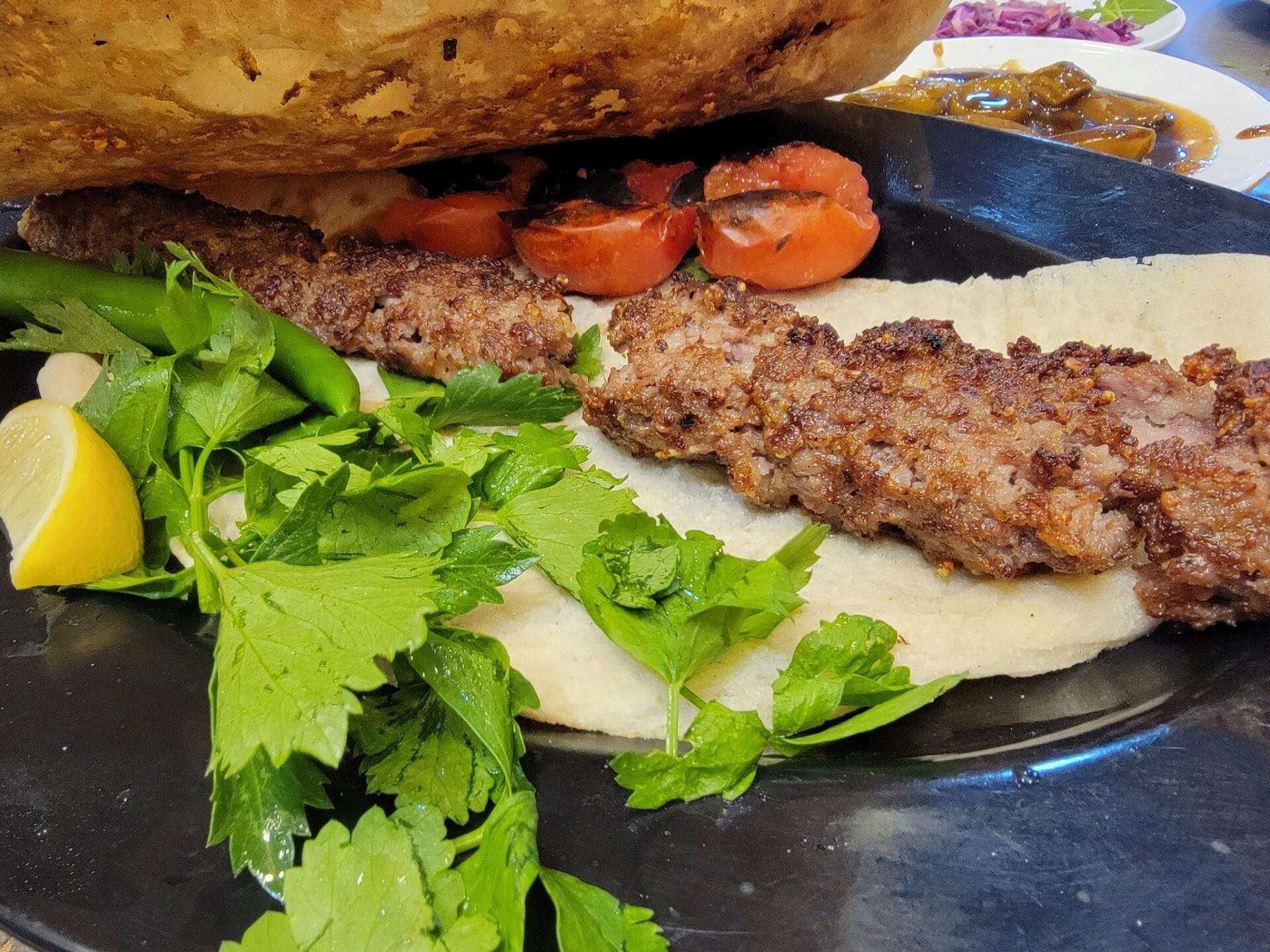 a plate of food with meat and vegetables
