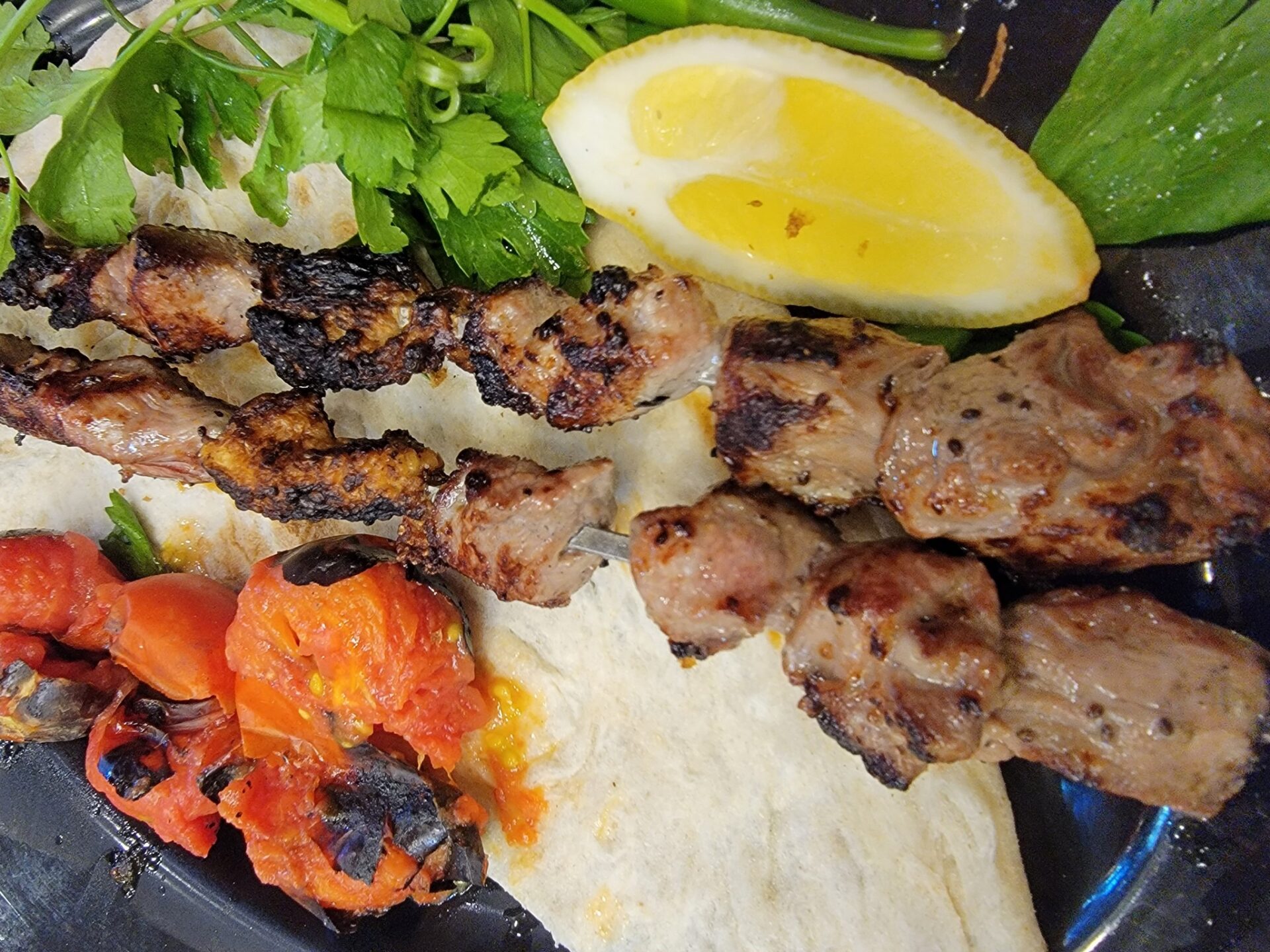 a plate of food with meat and vegetables