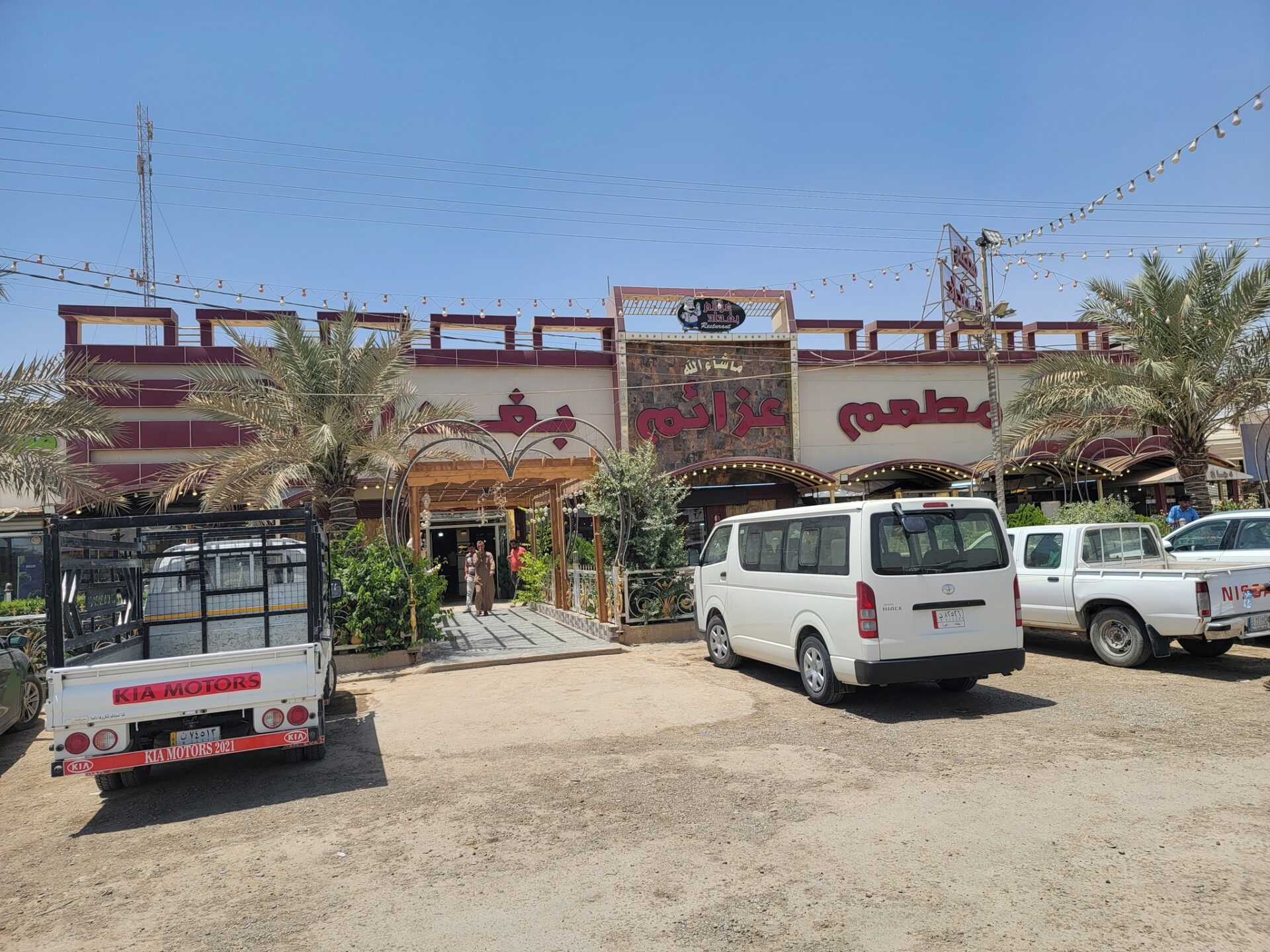 a group of vehicles parked in front of a building