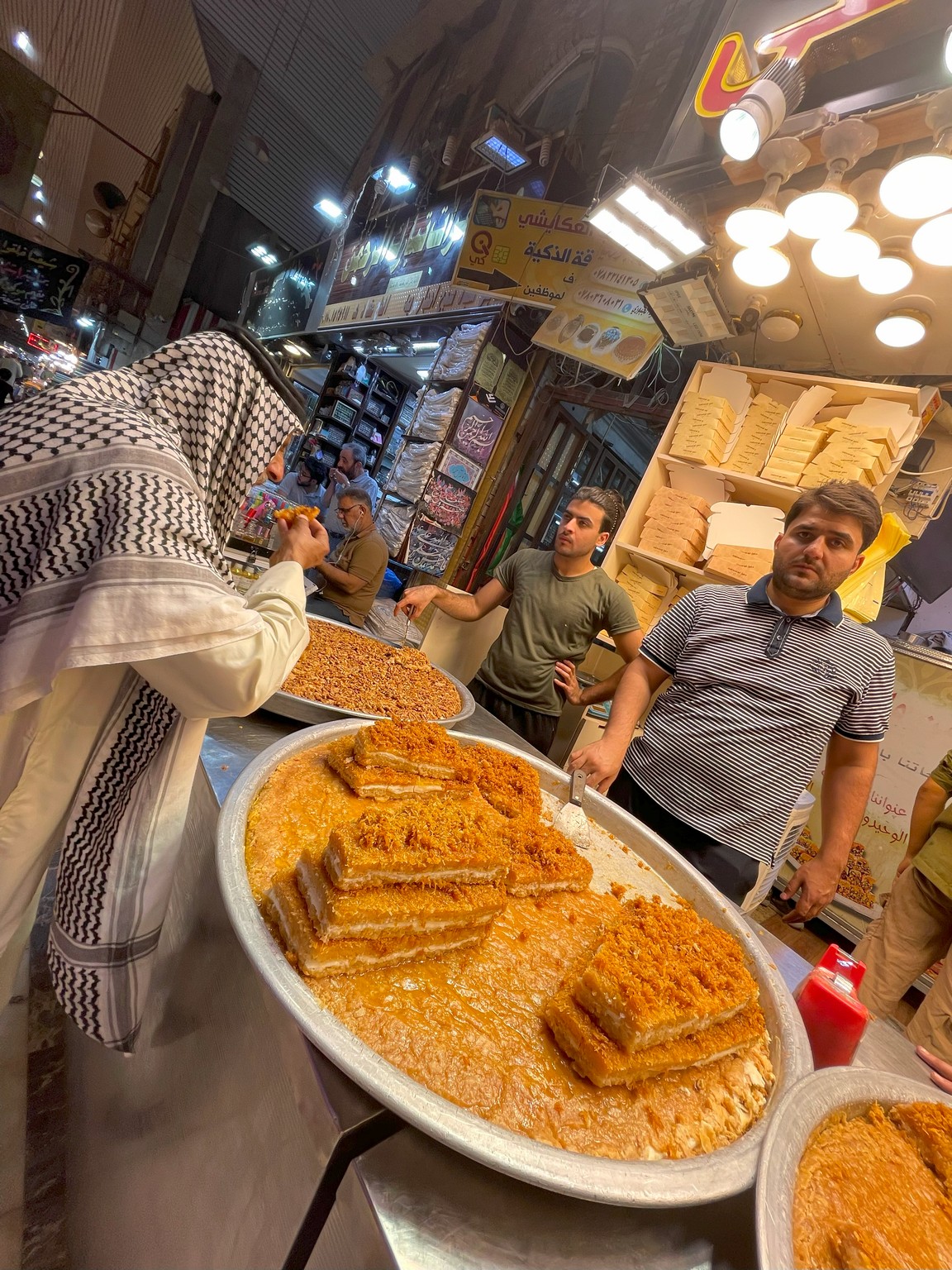 a man in a head scarf eating food
