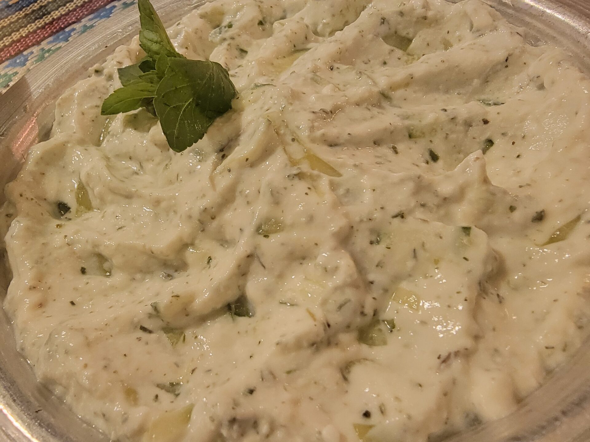 a bowl of food with a leafy green garnish