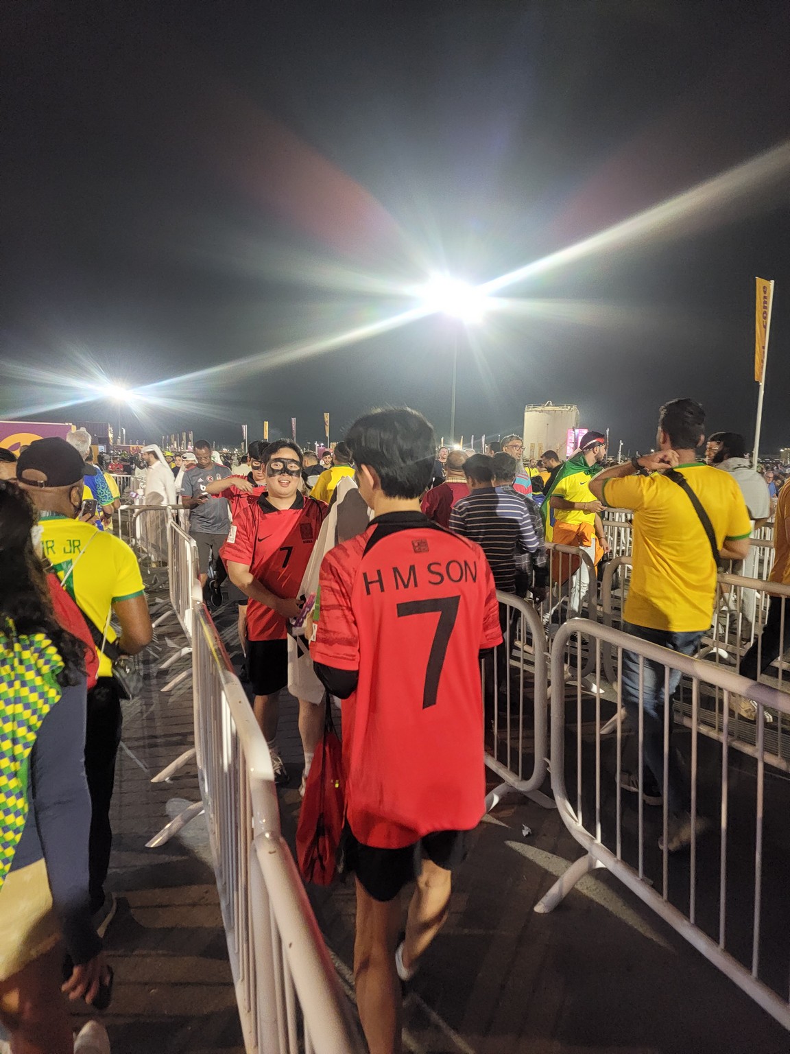 a group of people standing in a crowd