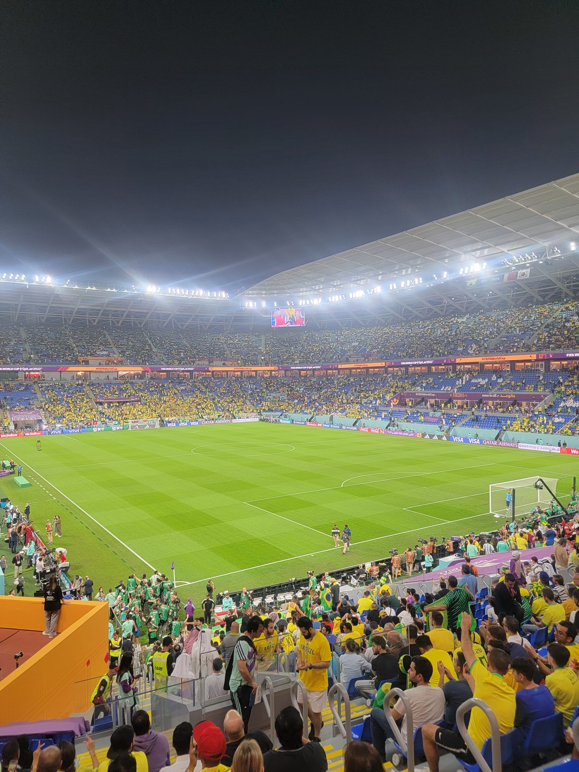 a football stadium with people in the stands