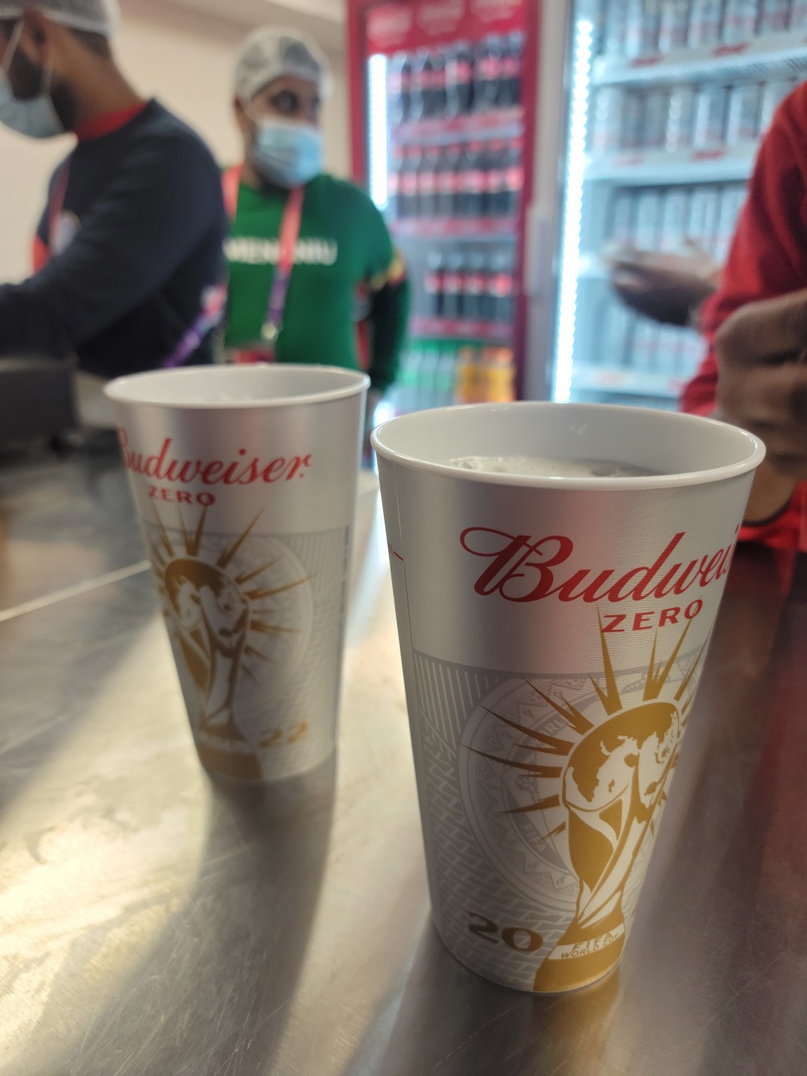 two cups of beer on a counter
