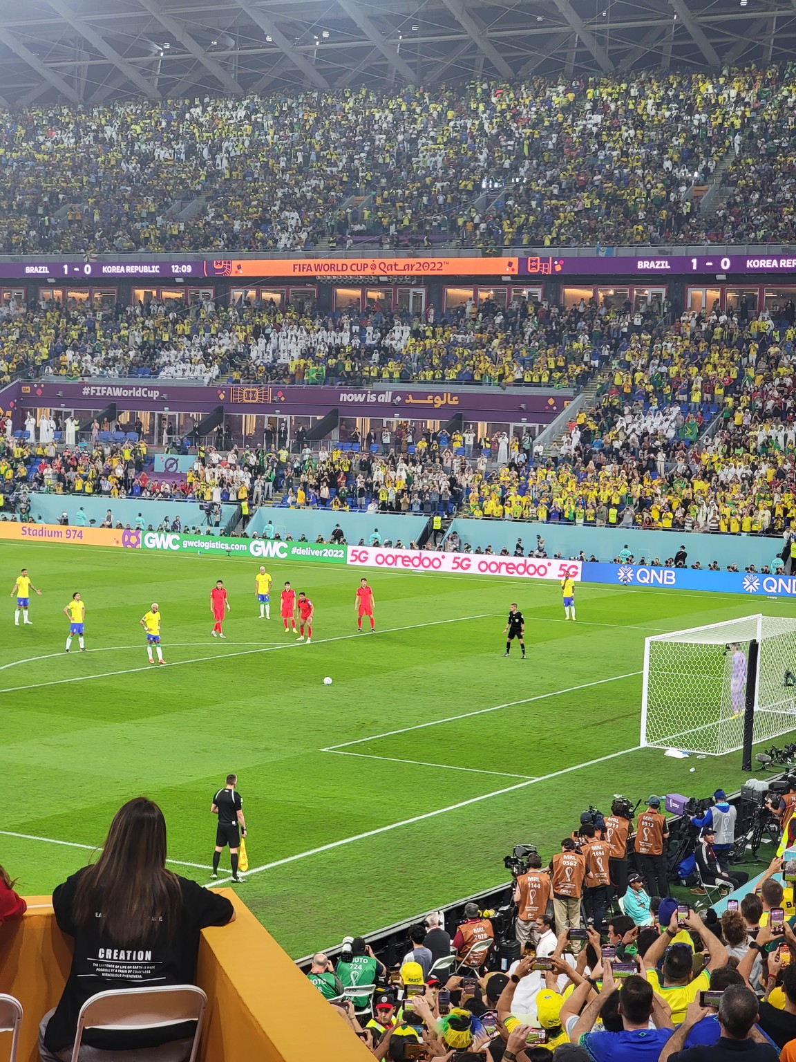 a football game with a crowd watching