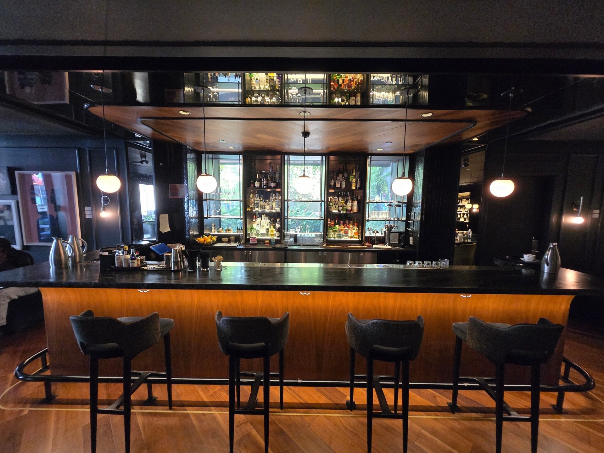 a bar with a counter and stools