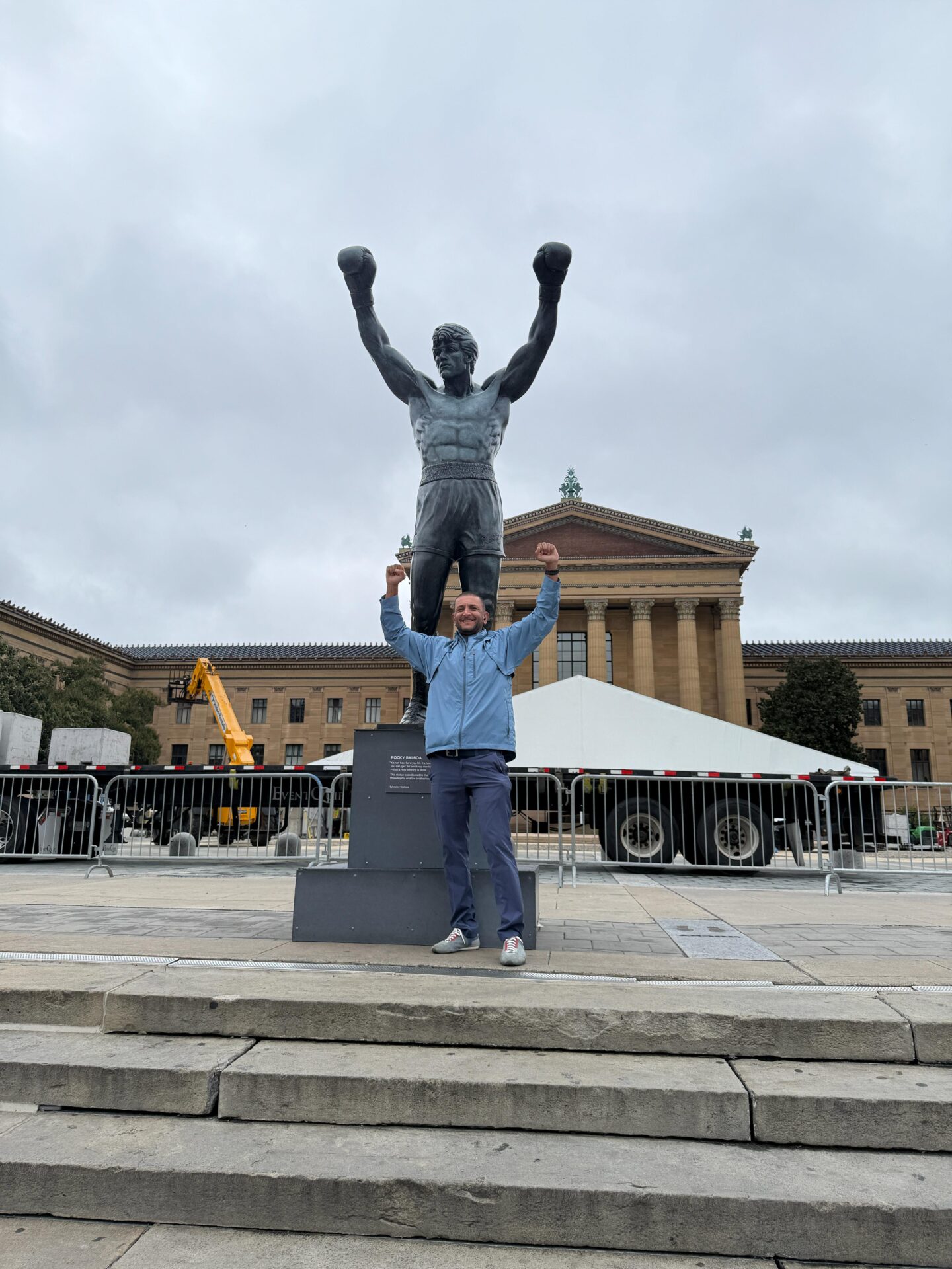 a man standing in front of a statue