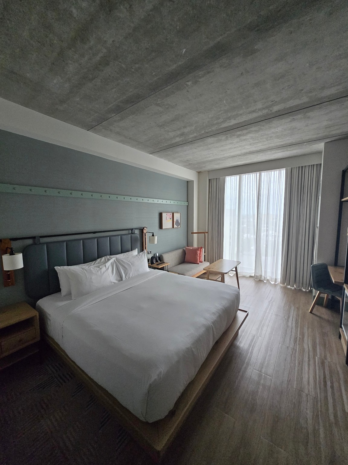 a room with a bed and a tv