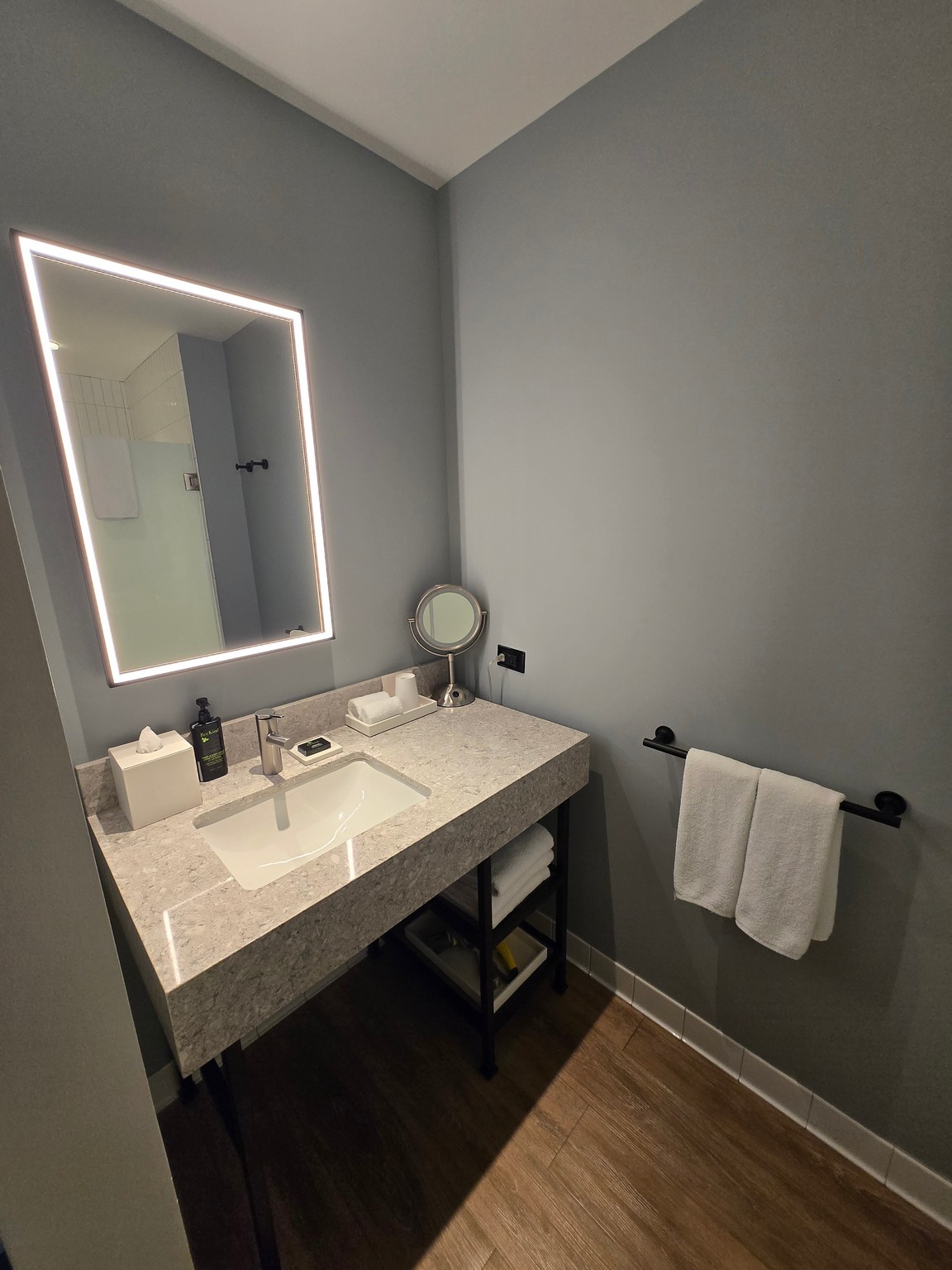 a bathroom with a mirror and sink