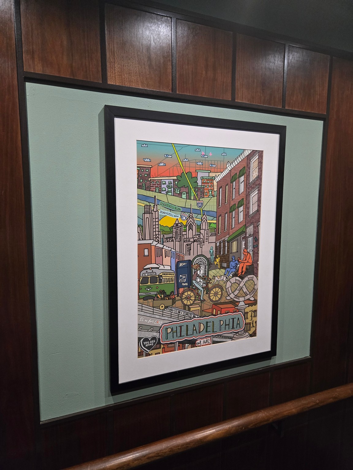 a framed picture on a wall