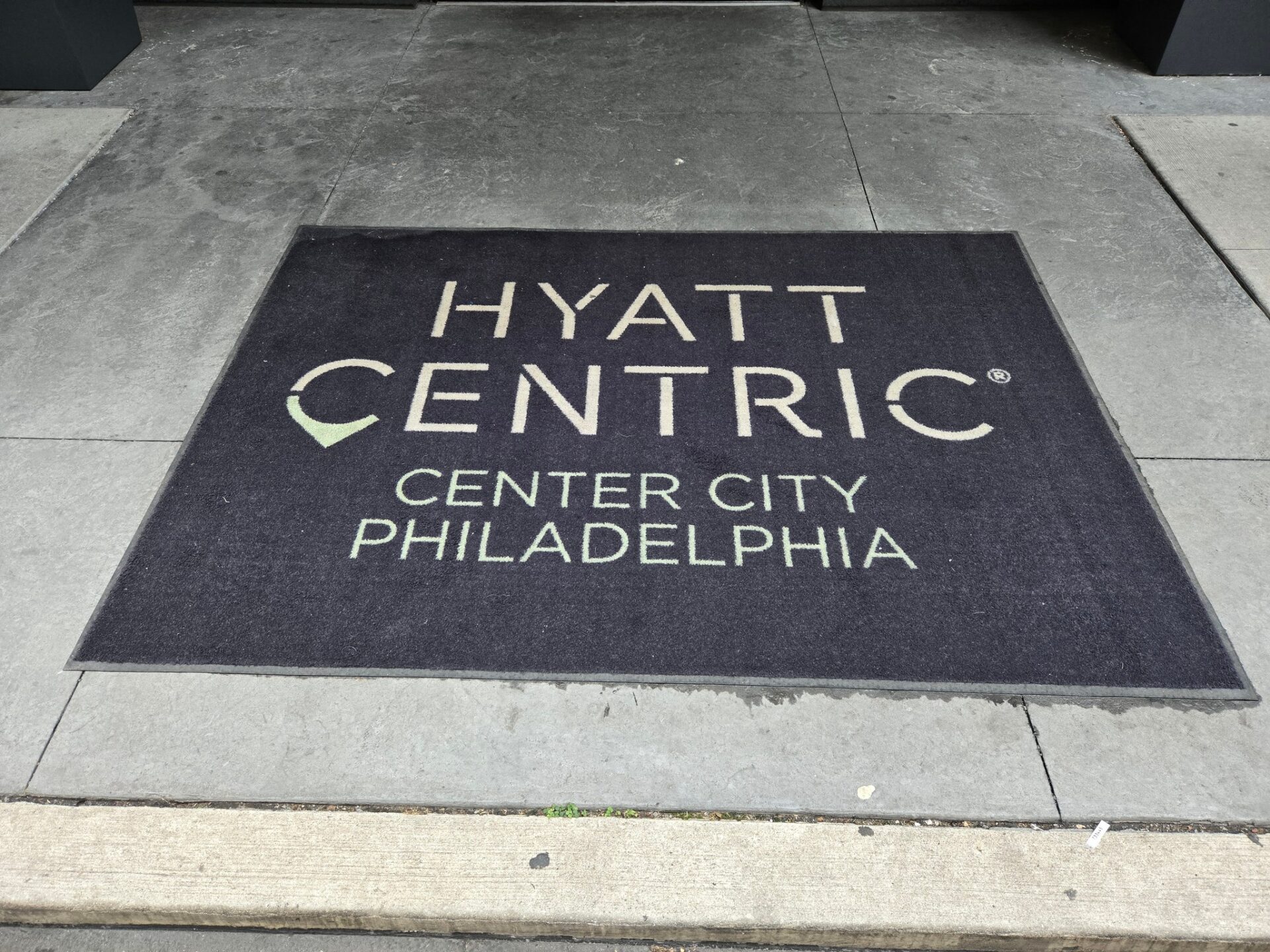 a black rectangular mat with white text on it