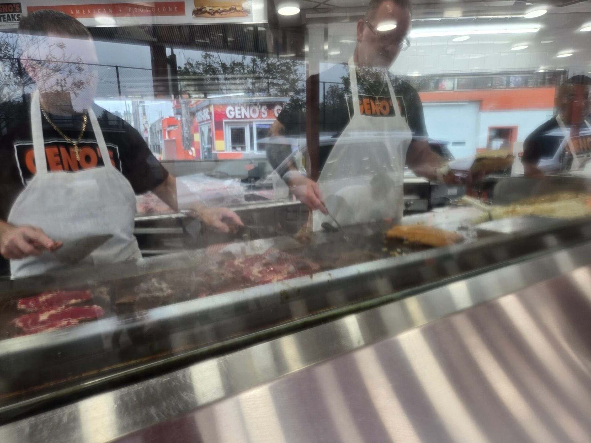 a group of men cooking meat
