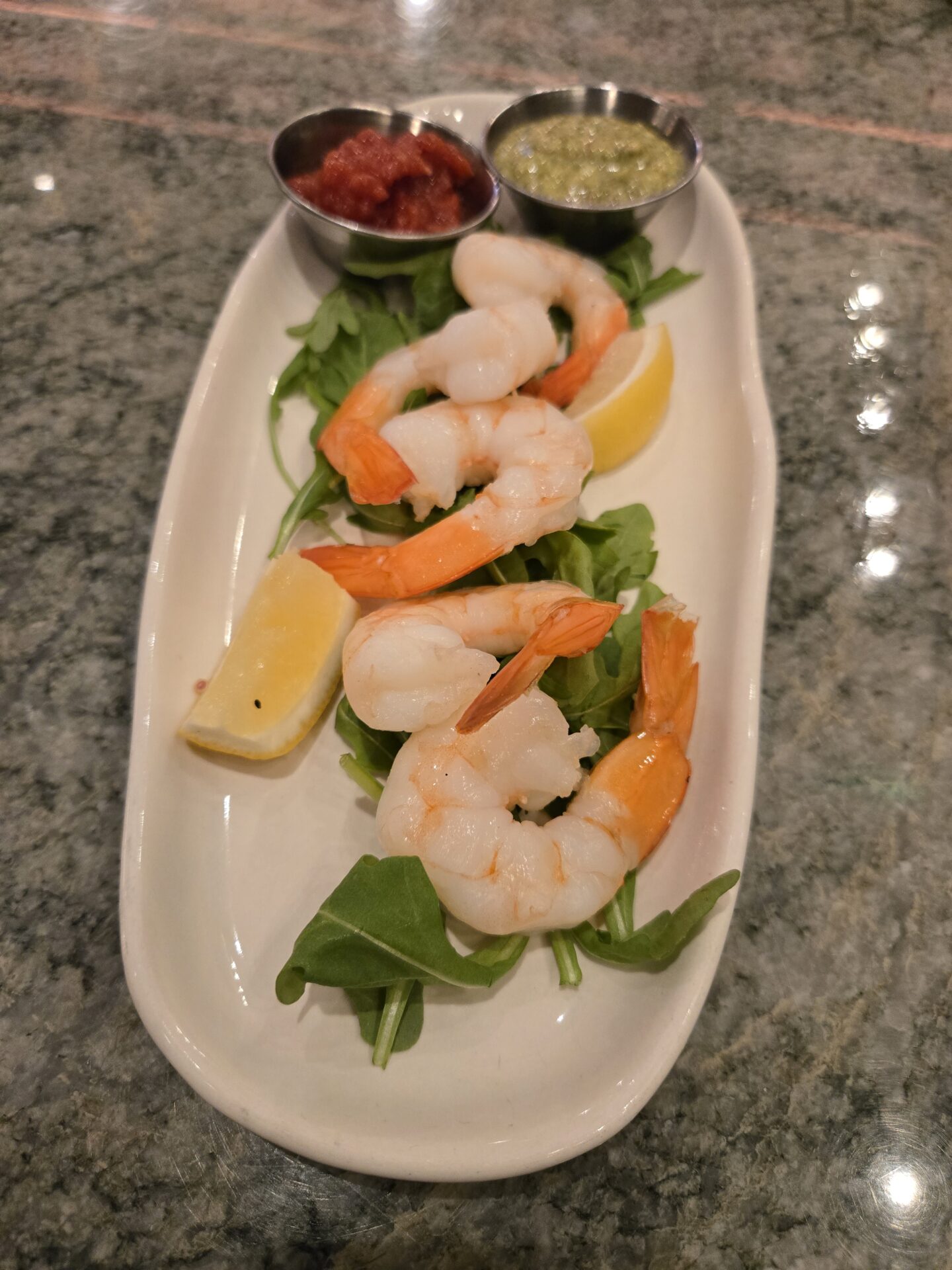 a plate of shrimp and salad
