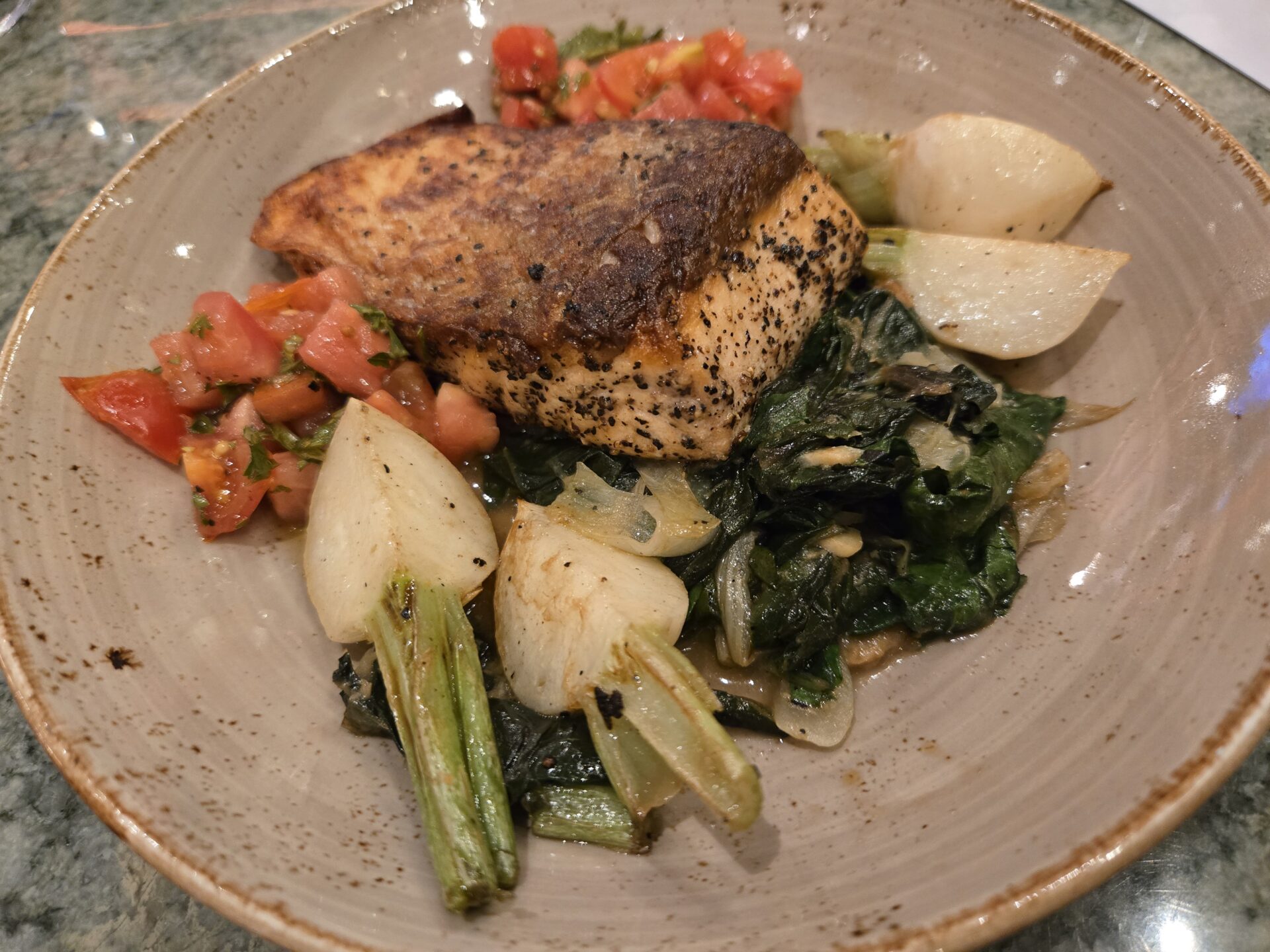 a plate of food on a marbled surface