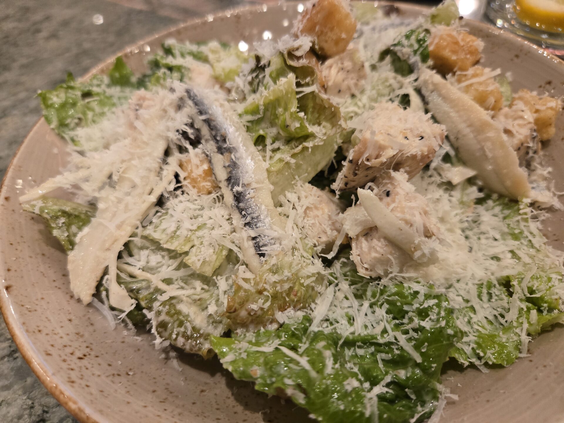 a plate of salad with cheese
