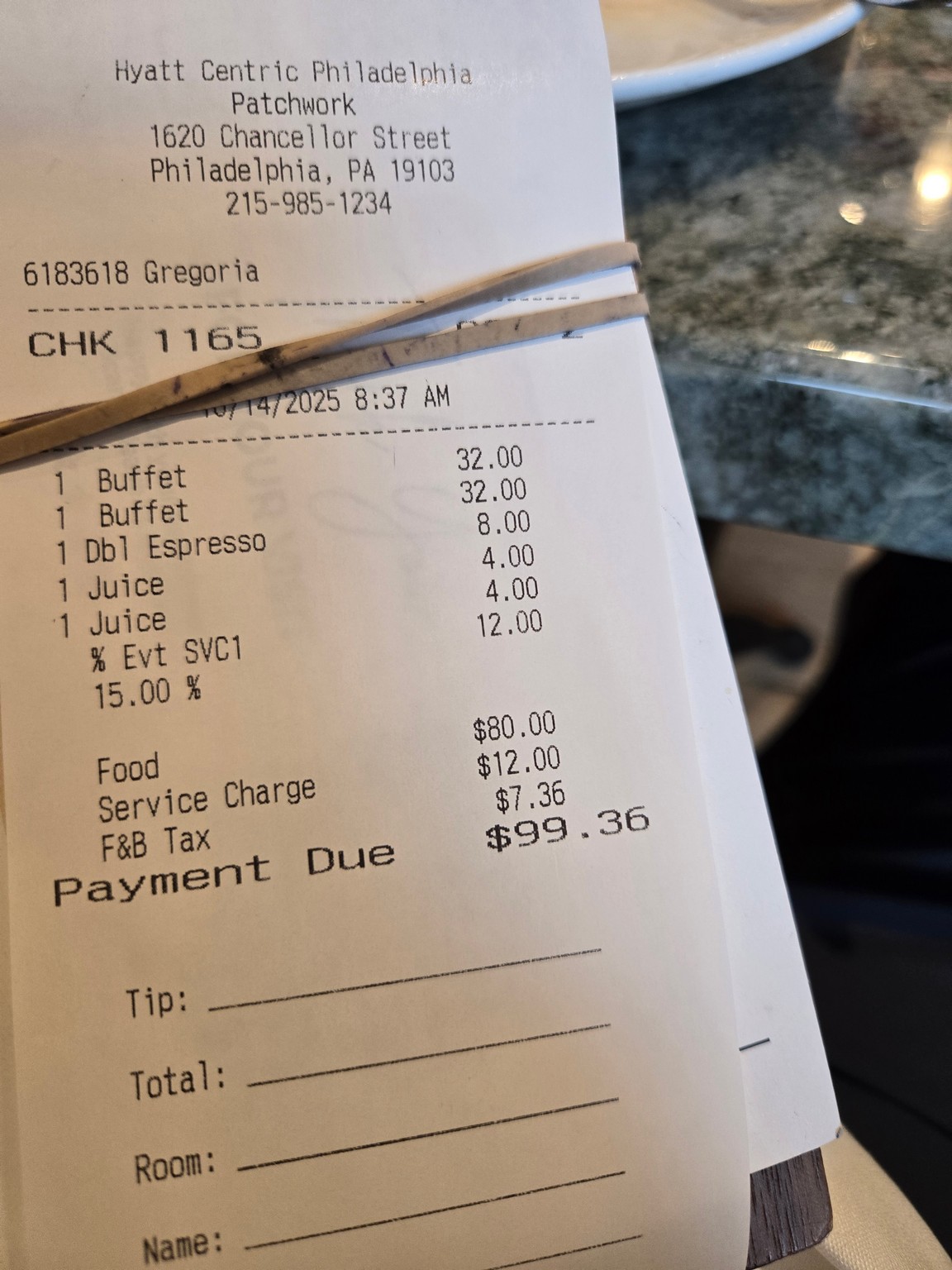 a receipt with a band on a table