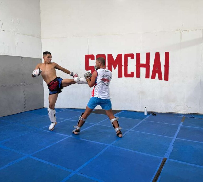 two men boxing in a gym