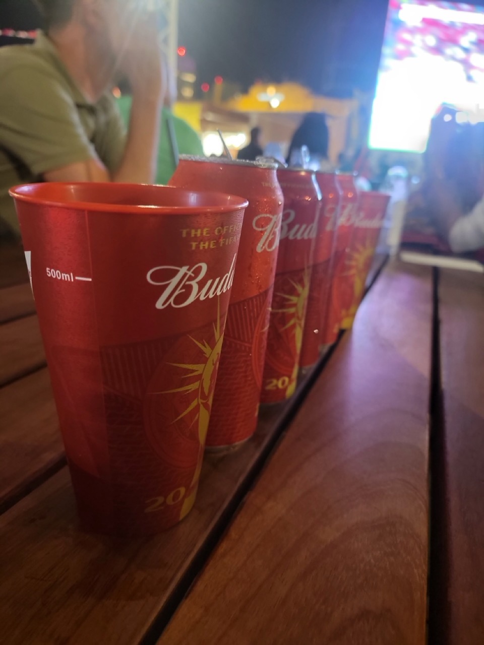 a row of red cups on a table