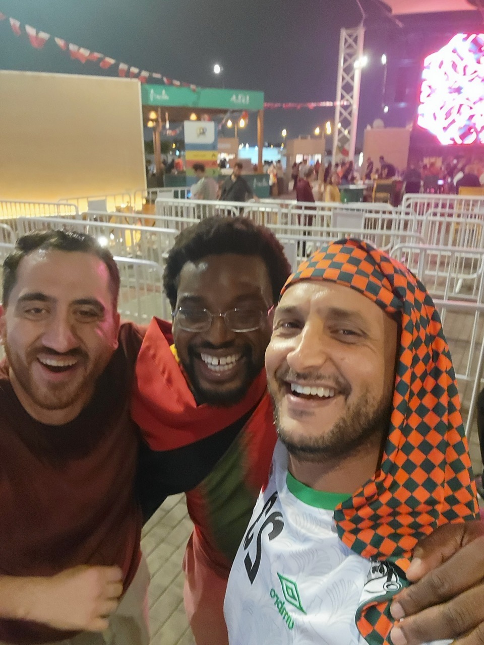 a group of men smiling at the camera