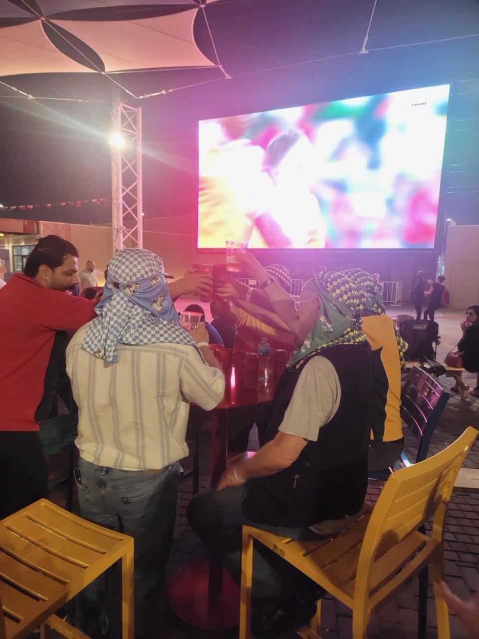 a group of people sitting at a table with drinks