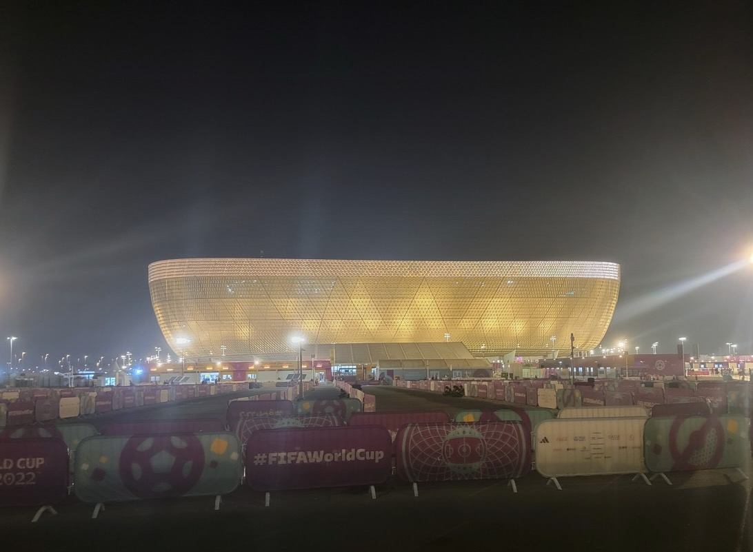 a large stadium with lights at night