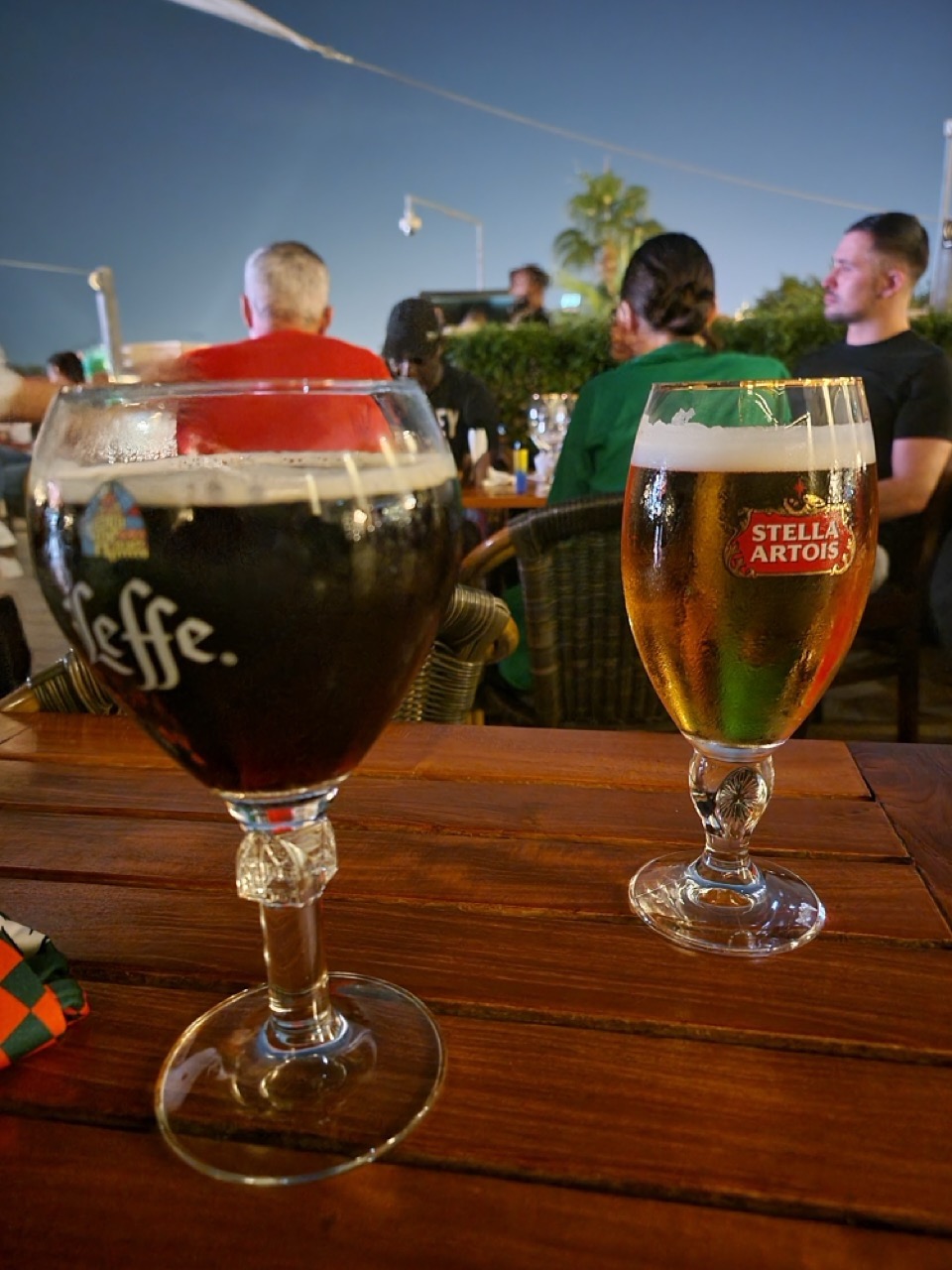 two glasses of beer on a table