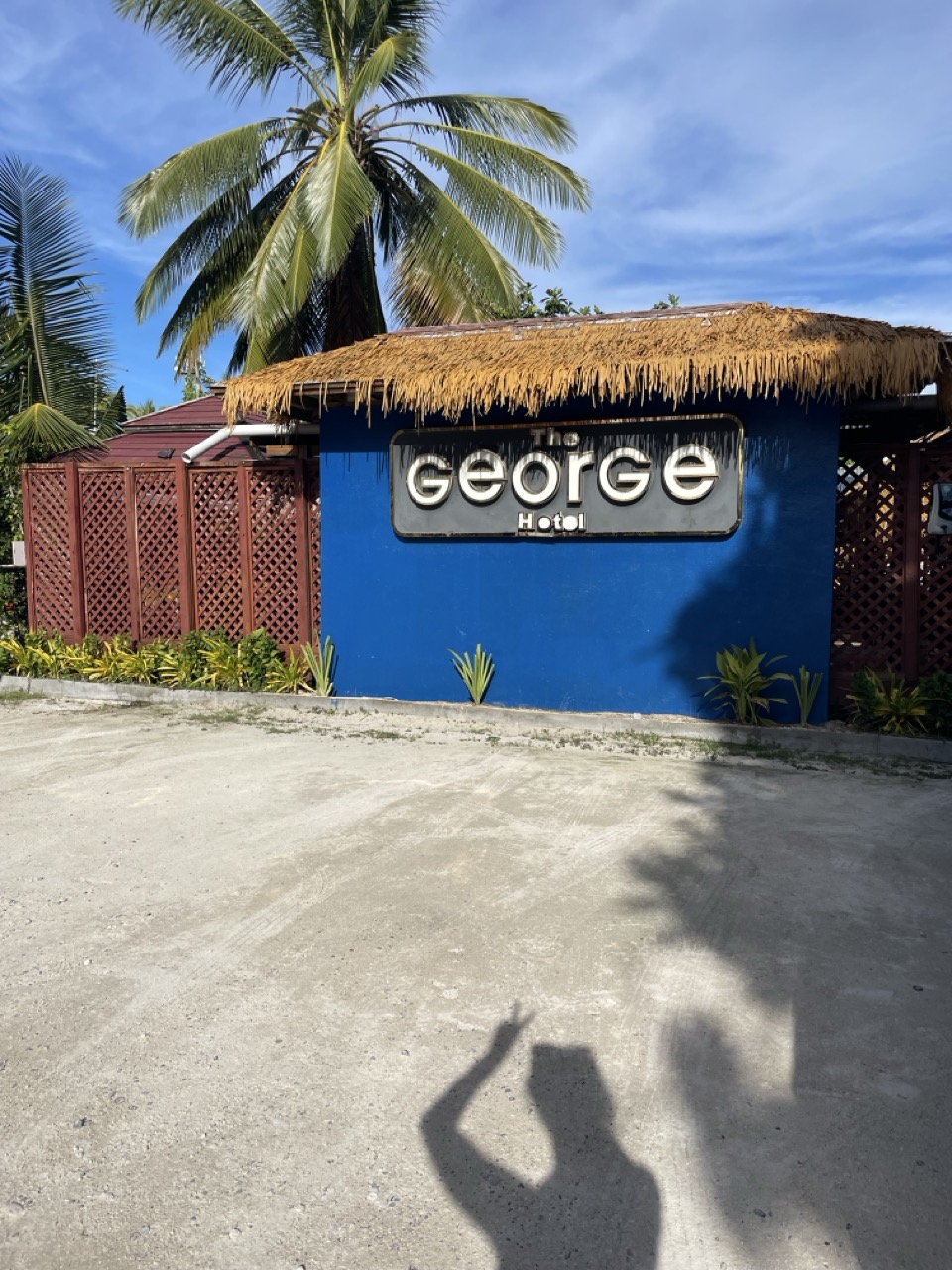 a blue building with a sign on it