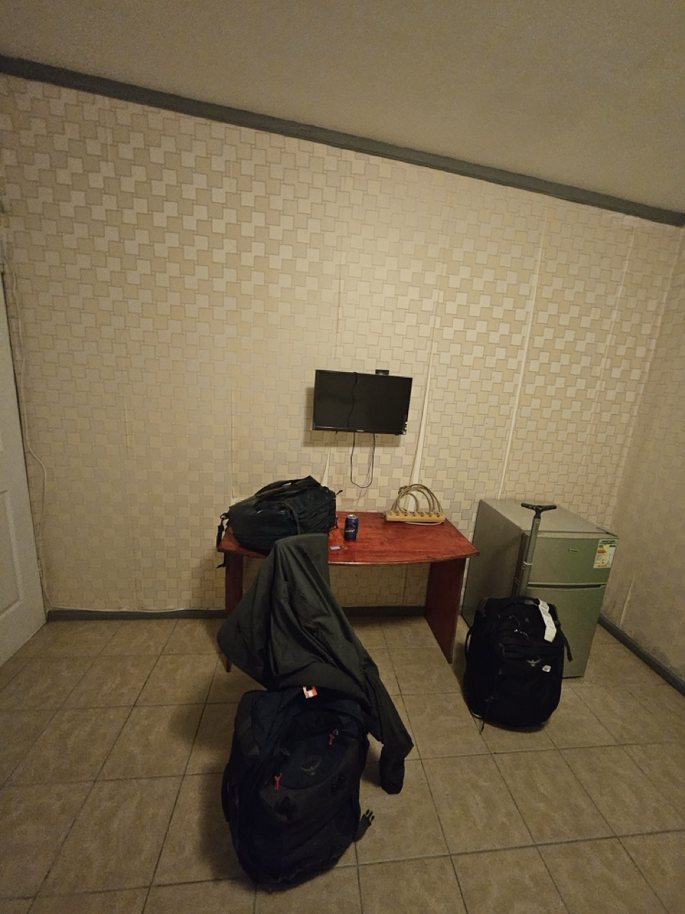 a room with a table and luggage
