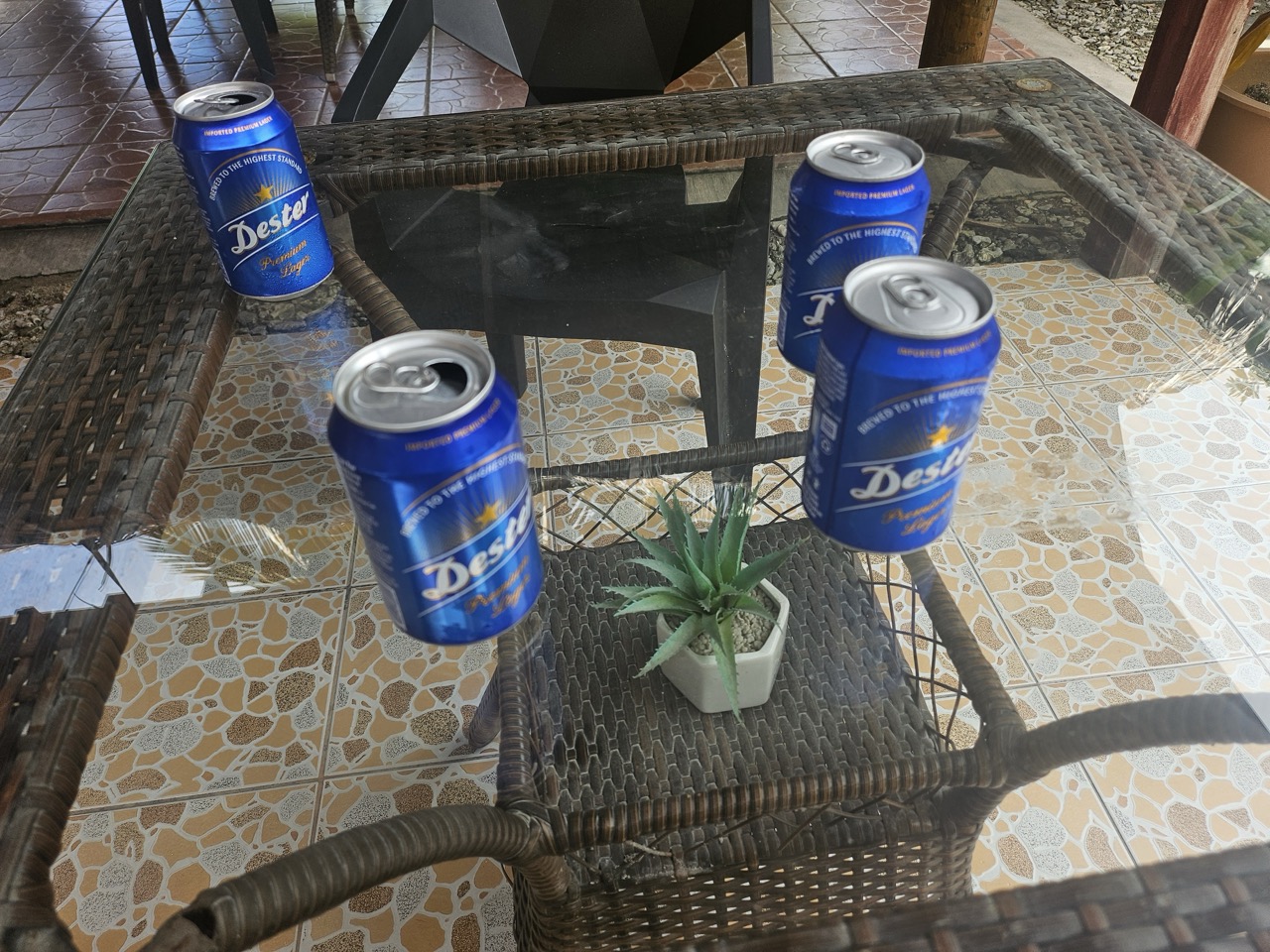 a group of blue cans on a glass table