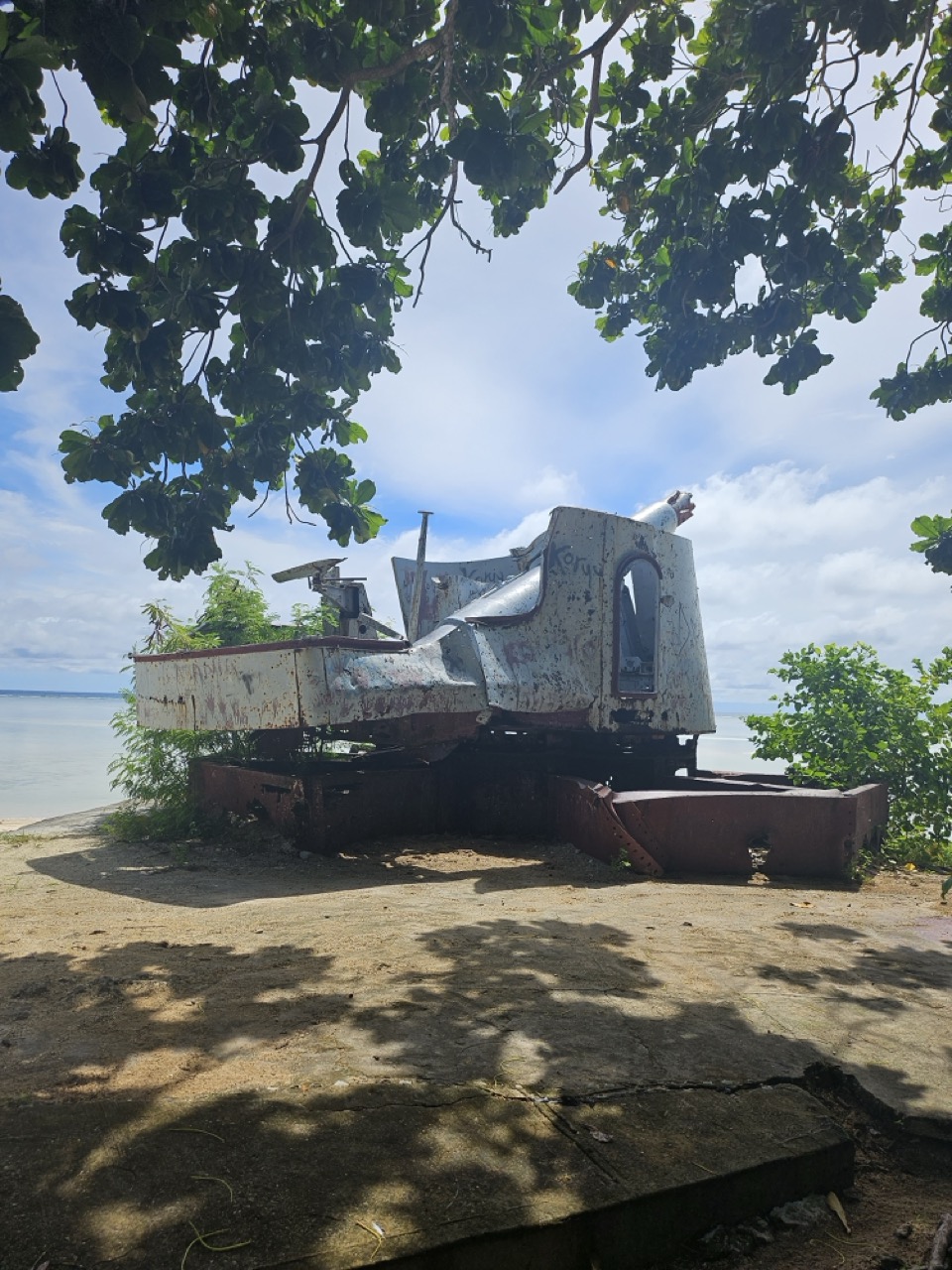 a rusty boat on a beach