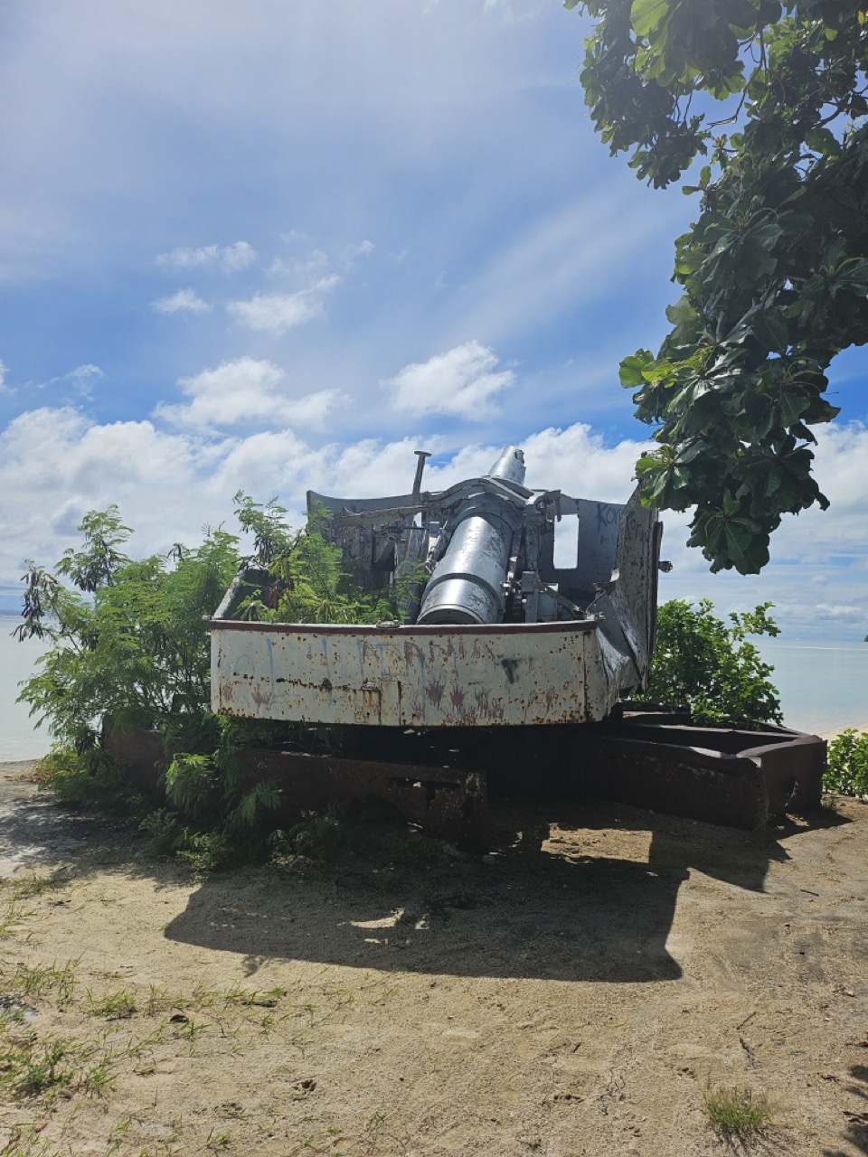 a rusty object on a beach
