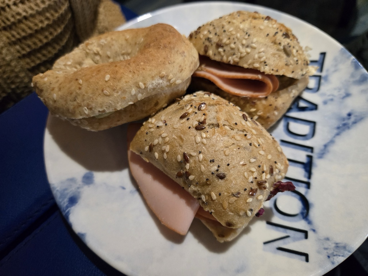 a plate of bagels with ham and cheese