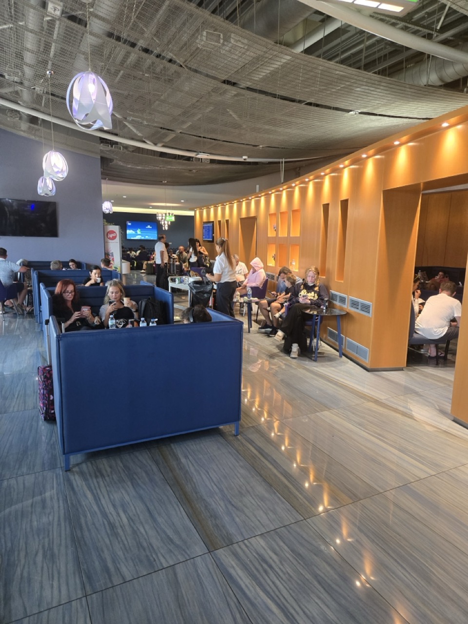 people sitting at tables in a restaurant