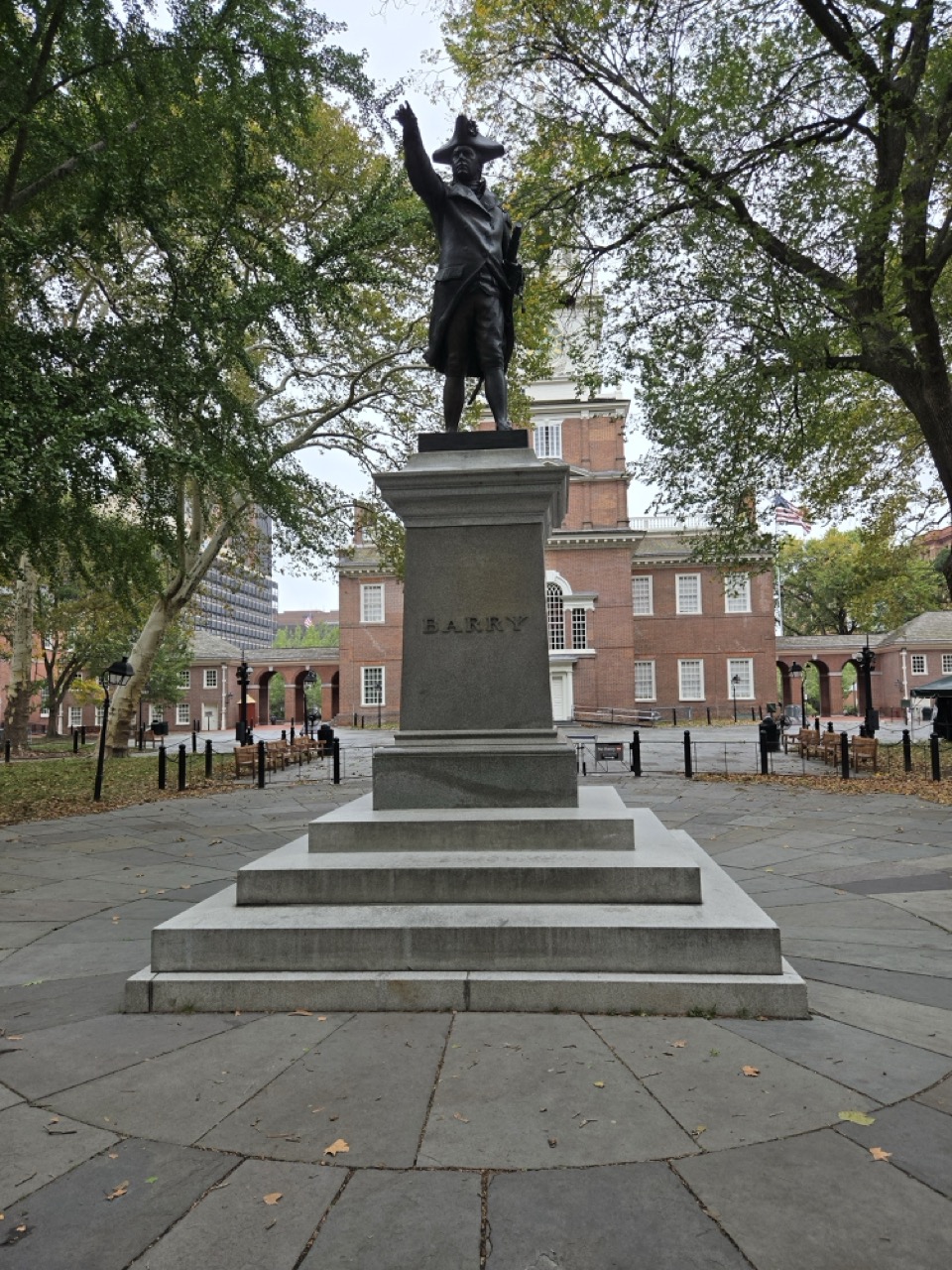 a statue of a man holding a flag