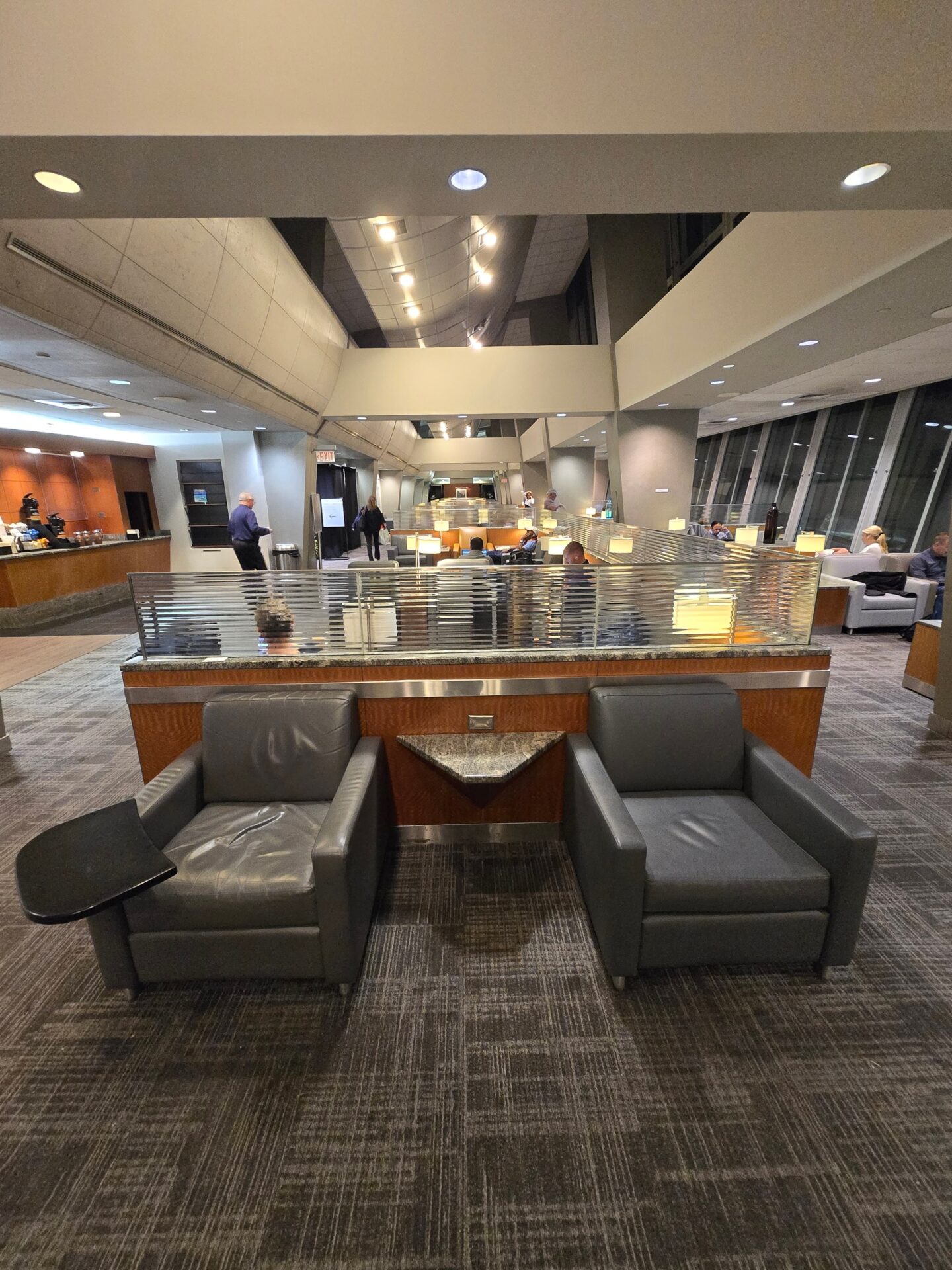 a lobby with a reception desk and chairs