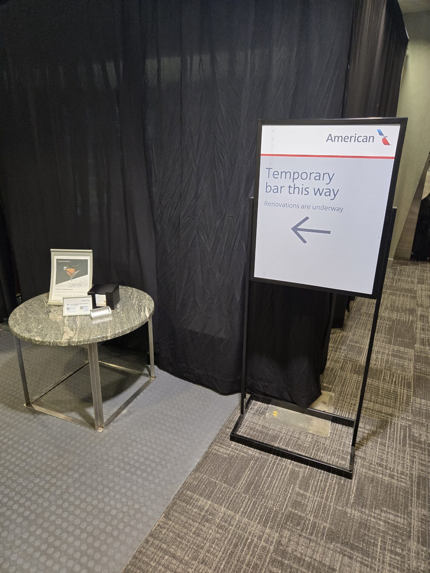 a sign next to a table