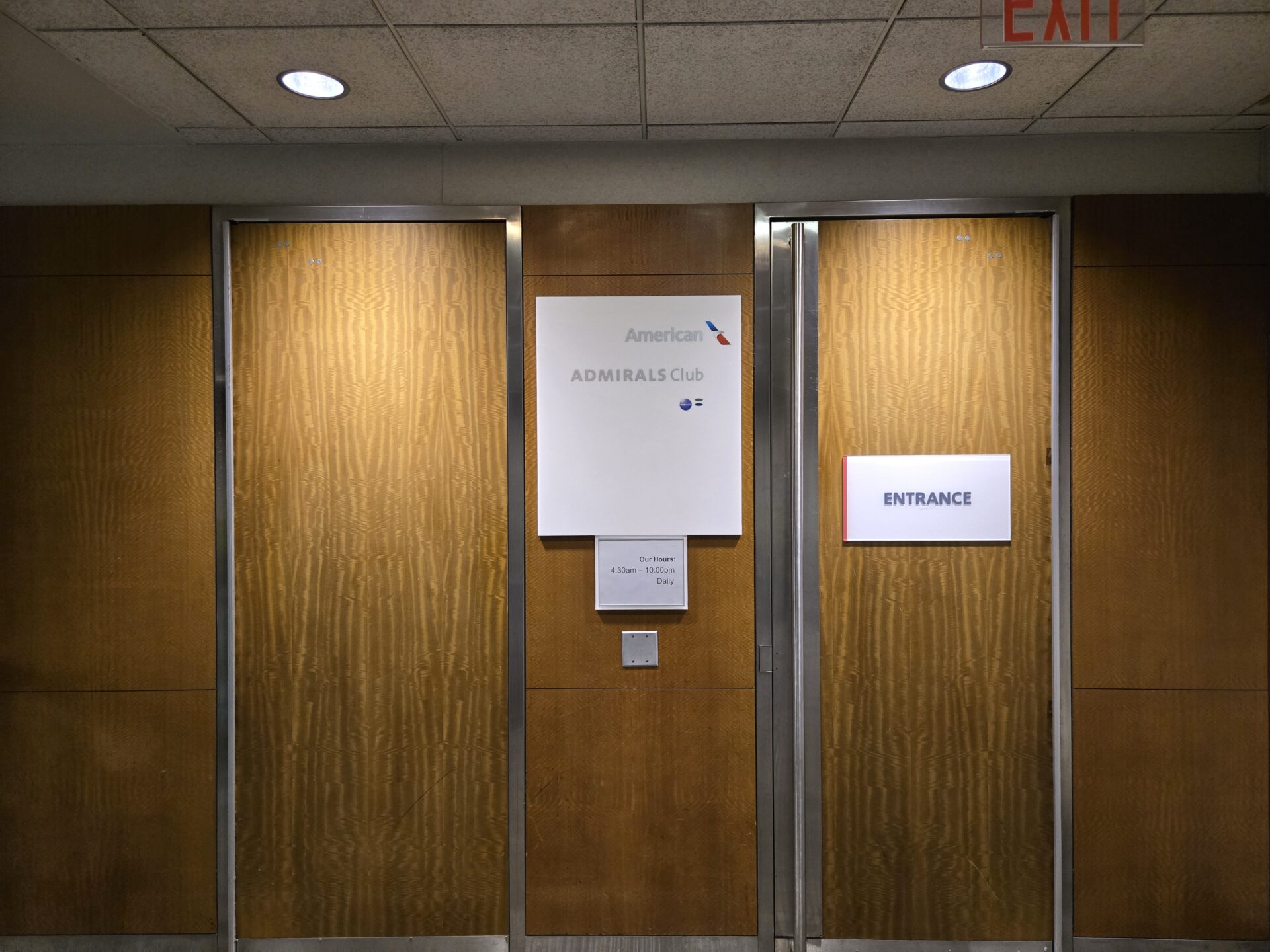 a group of doors with signs on them