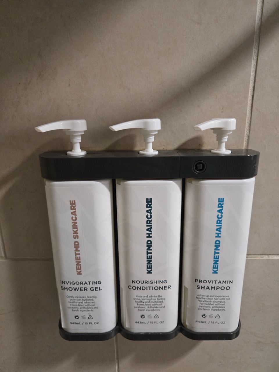 a group of shampoo bottles on a wall