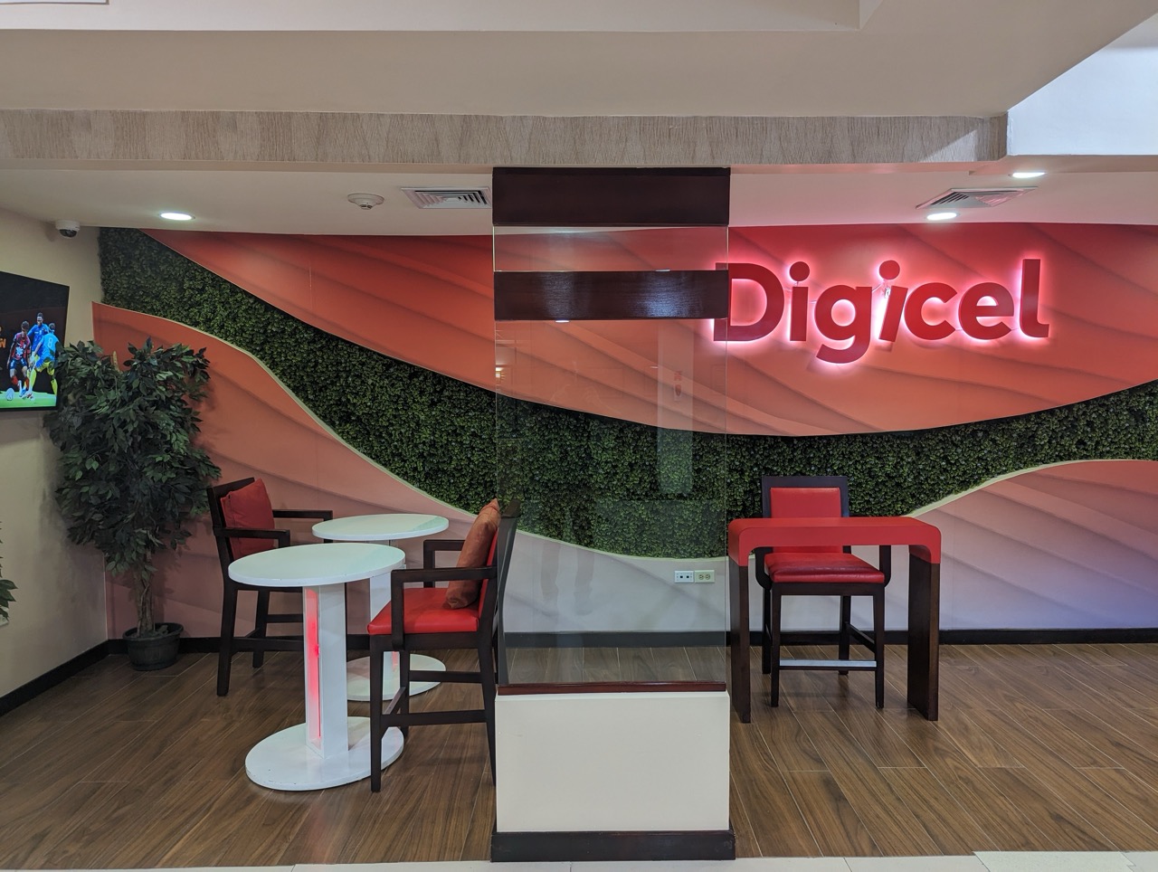 a room with a sign and chairs