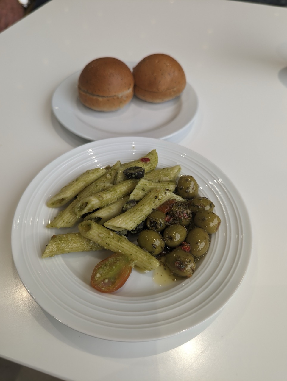 a plate of pasta and olives