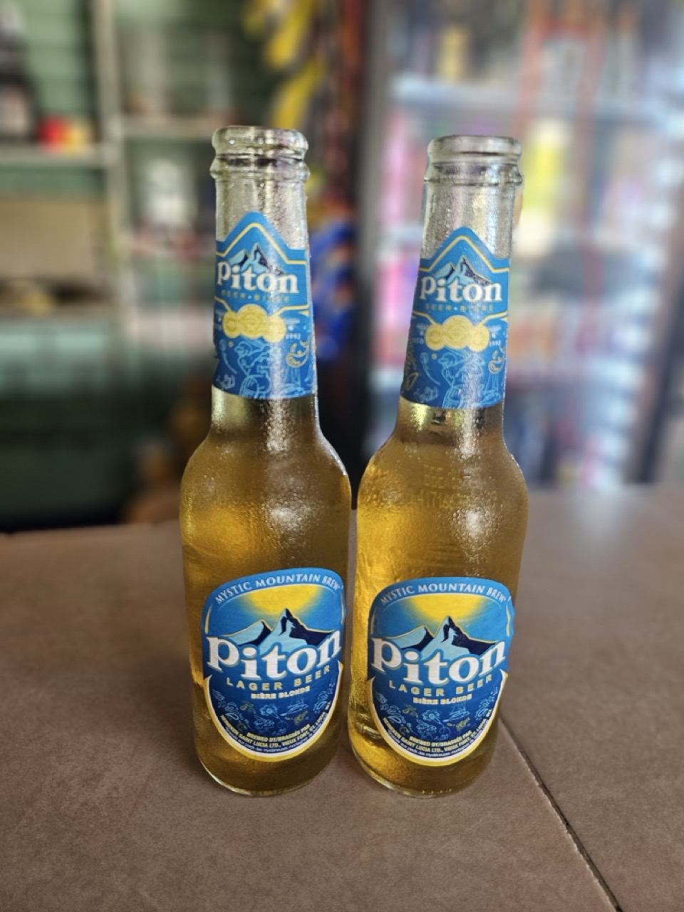 two bottles of beer on a table