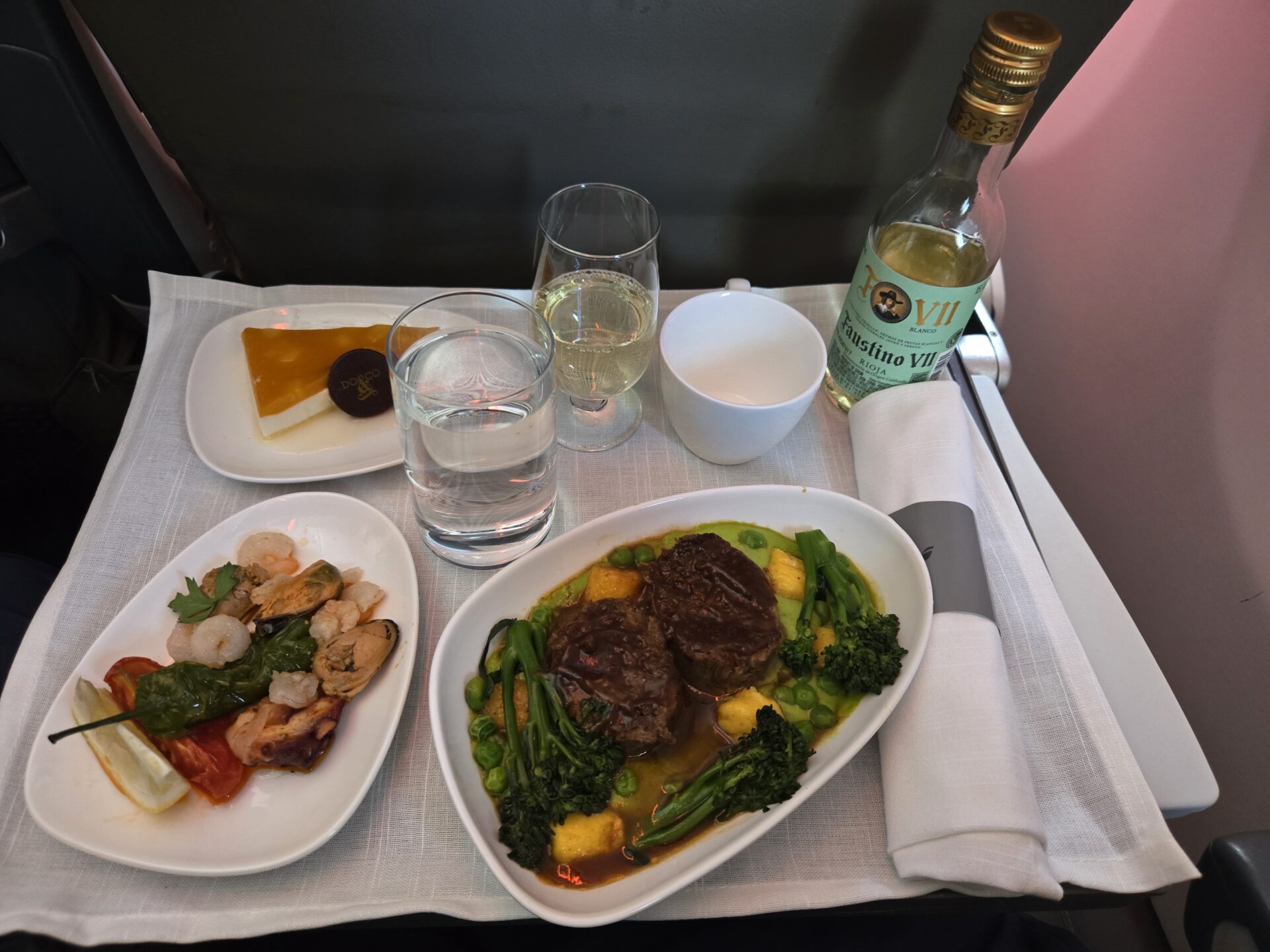 a plate of food and glasses on a table