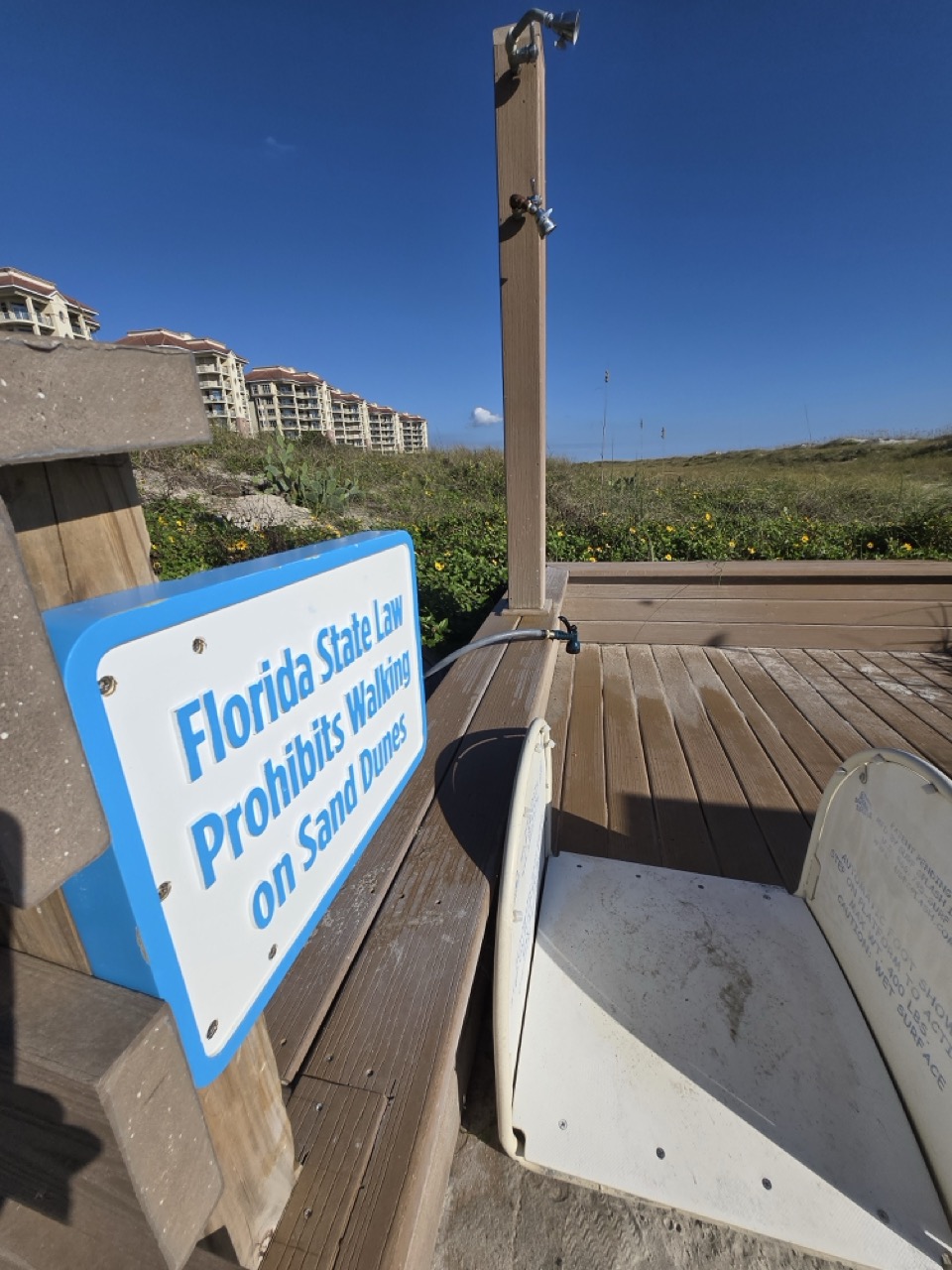 a sign on a wood deck